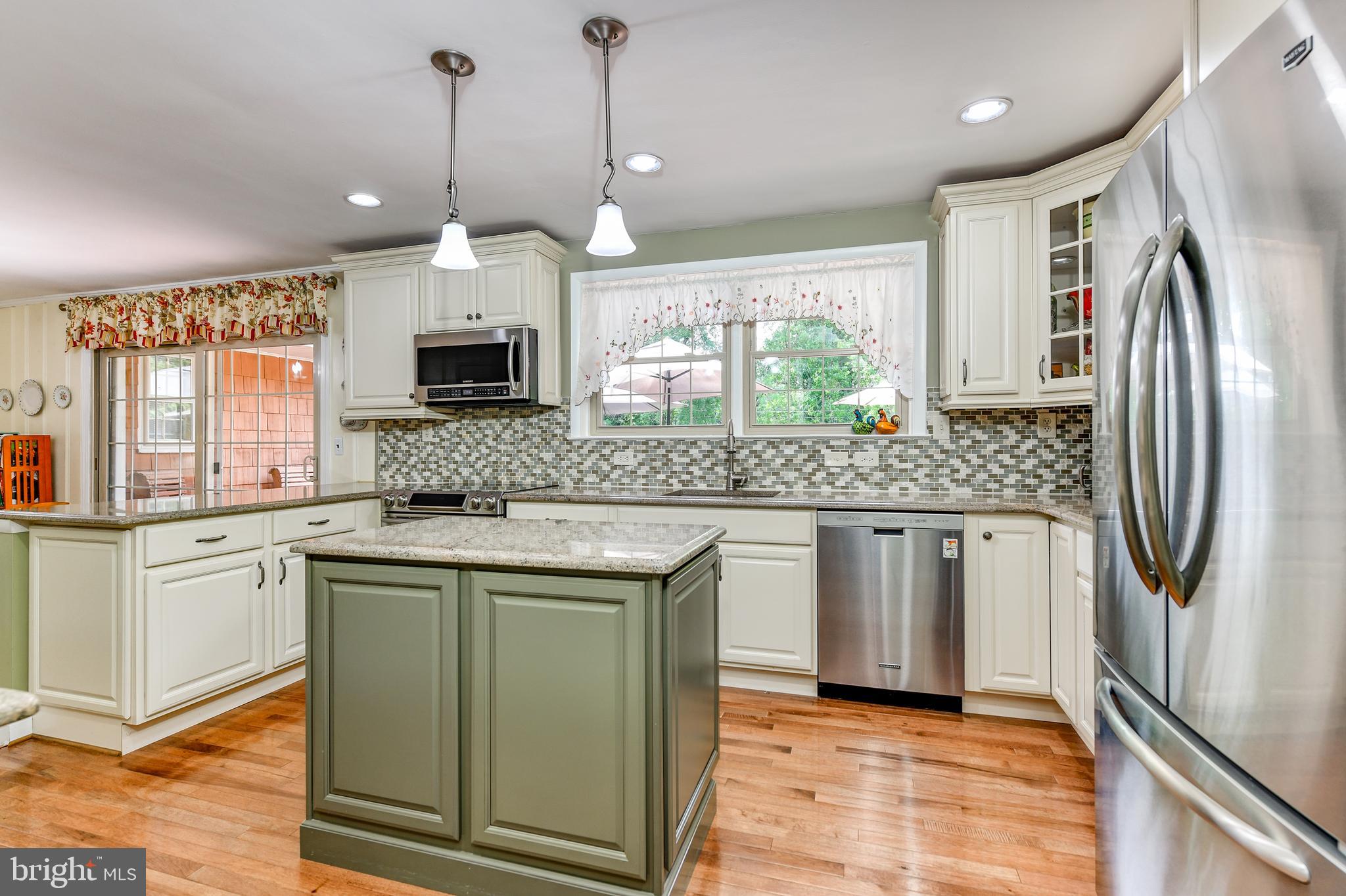 8212 Tally Ho Road Lutherville-Timonium, MD 21093 - Photo 9 of 42 Recessed lights illuminate honey-toned hardwoods