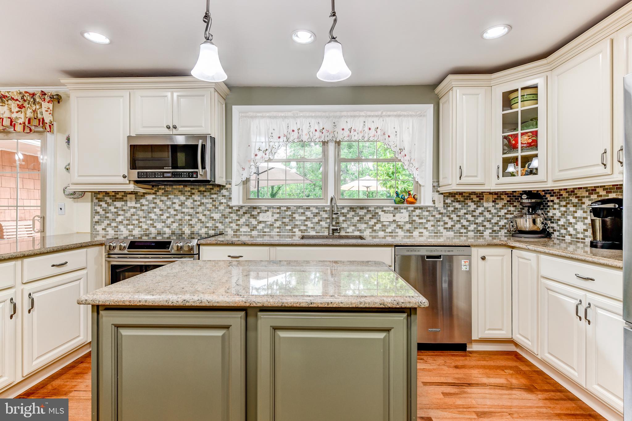 8212 Tally Ho Road Lutherville-Timonium, MD 21093 - Photo 10 of 42 Tiled backsplash and granite counters