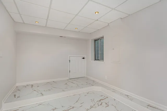 a house view with swimming pool in front of it