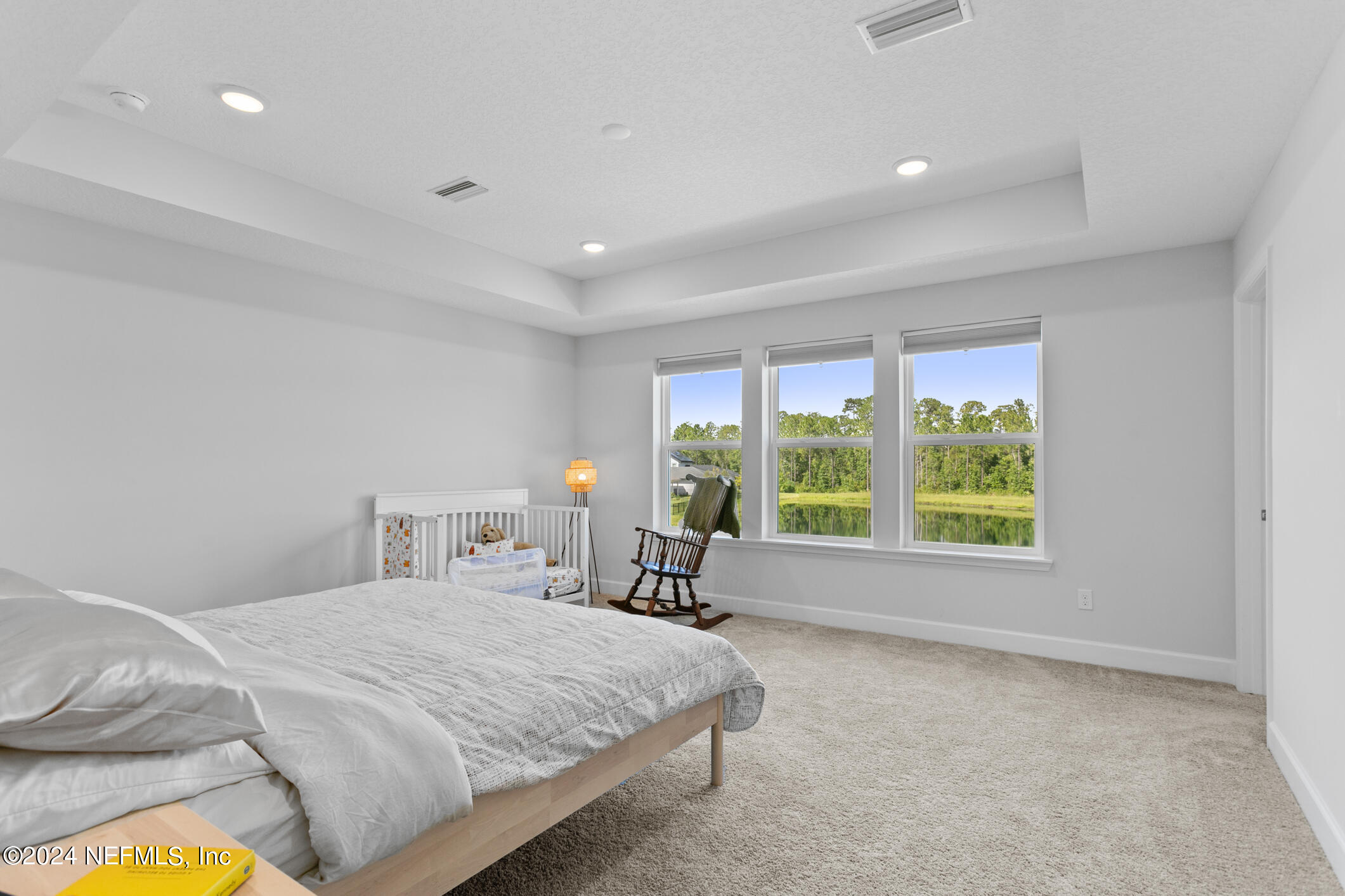 10020 Invention Lane Jacksonville, FL 32256 - Photo 34 of 87 a bedroom with a bed and a window