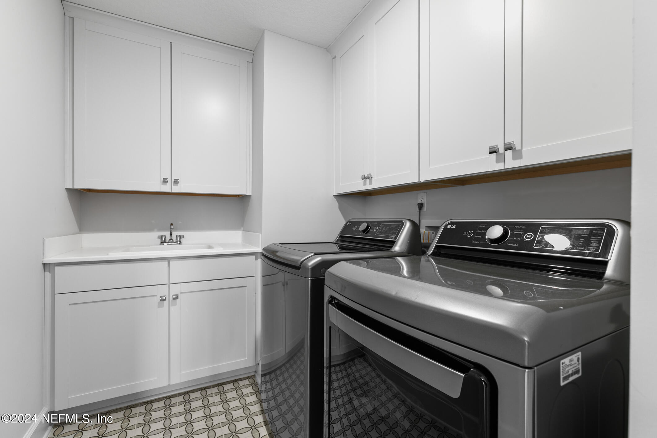 10020 Invention Lane Jacksonville, FL 32256 - Photo 43 of 87 a kitchen with a sink cabinets and appliances