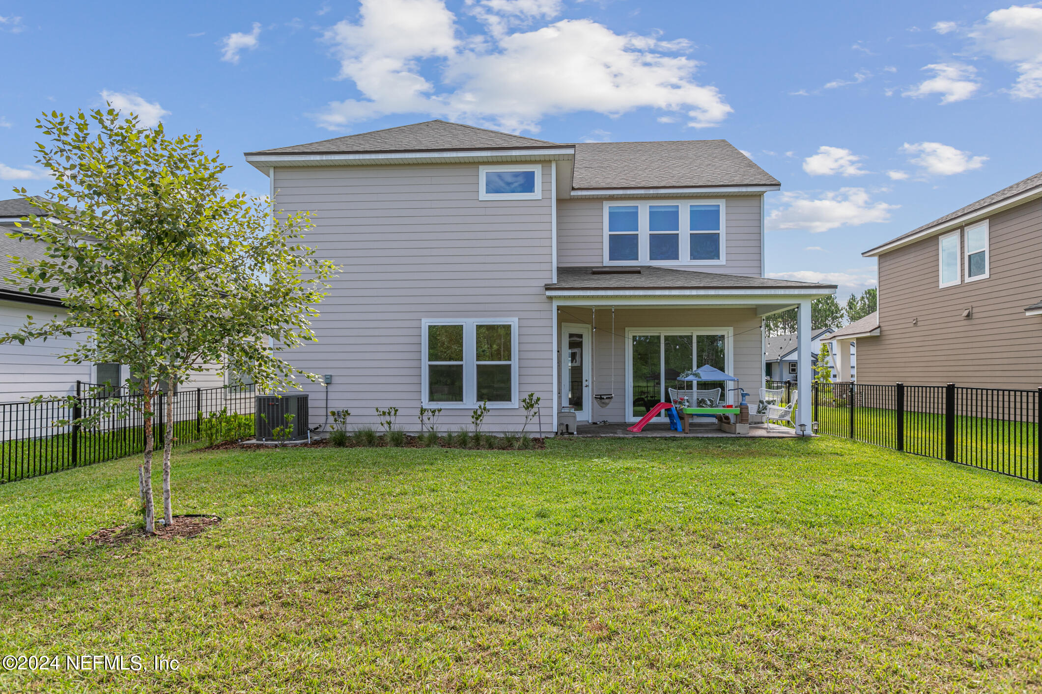 10020 Invention Lane Jacksonville, FL 32256 - Photo 51 of 87 a view of a house with a yard and sitting area