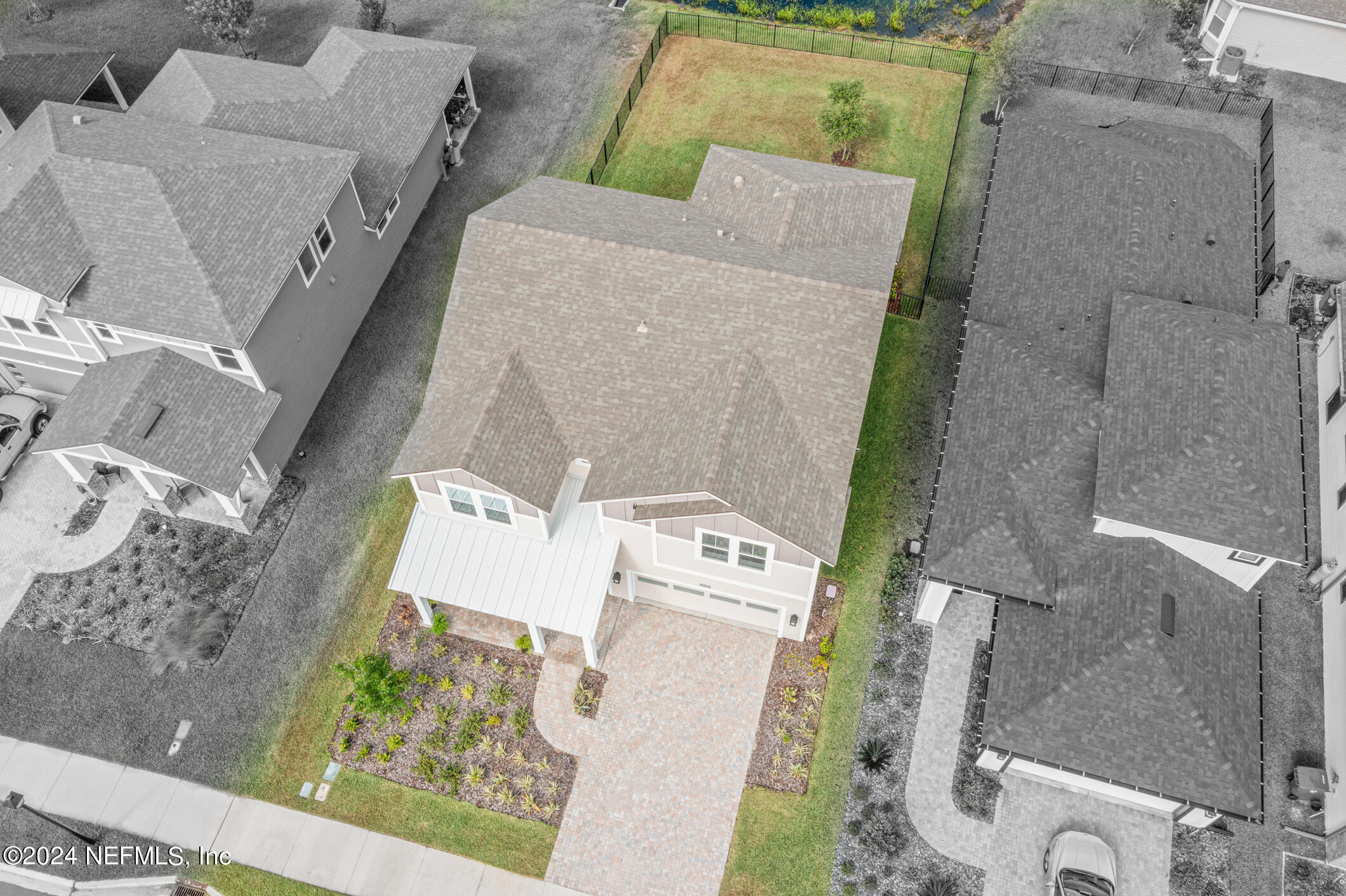 10020 Invention Lane Jacksonville, FL 32256 - Photo 60 of 87 an aerial view of a house with a yard and wooden deck