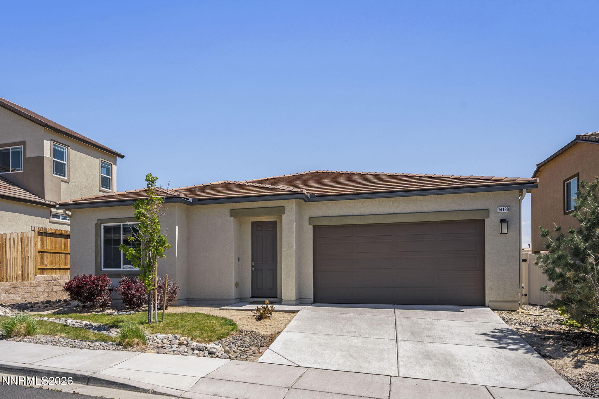 a front view of a house with yard