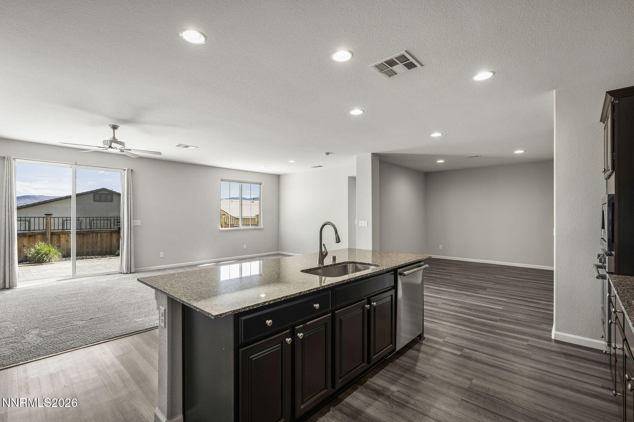 14138 Glowing Amber Court Reno, NV 89511 - Photo 14 of 36 a kitchen with a sink cabinets and wooden floor
