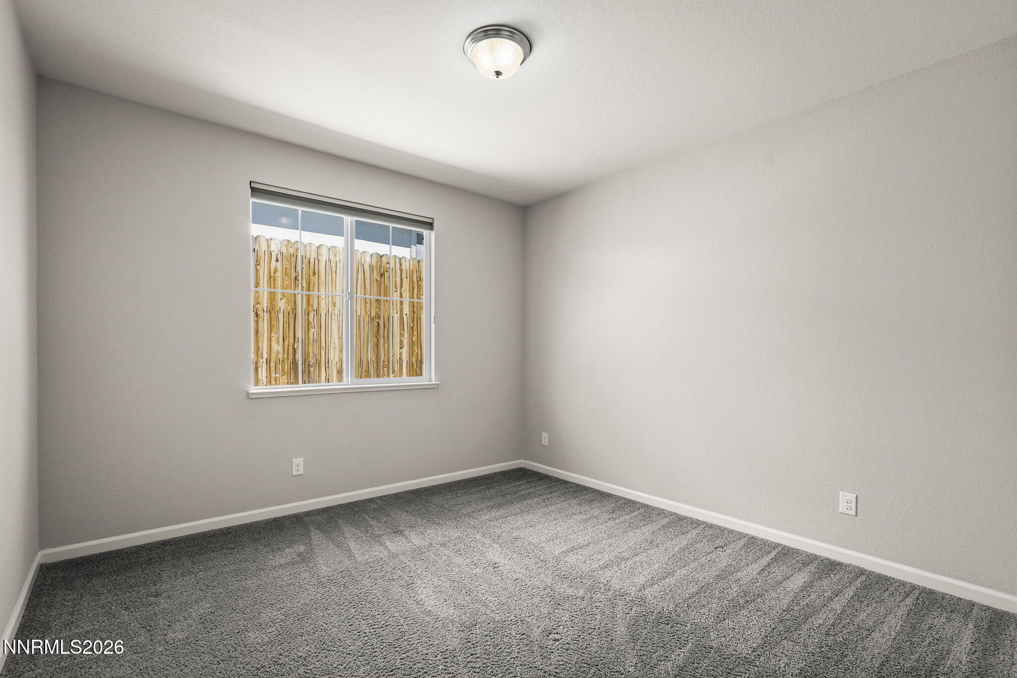 14138 Glowing Amber Court Reno, NV 89511 - Photo 27 of 36 an empty room with a window