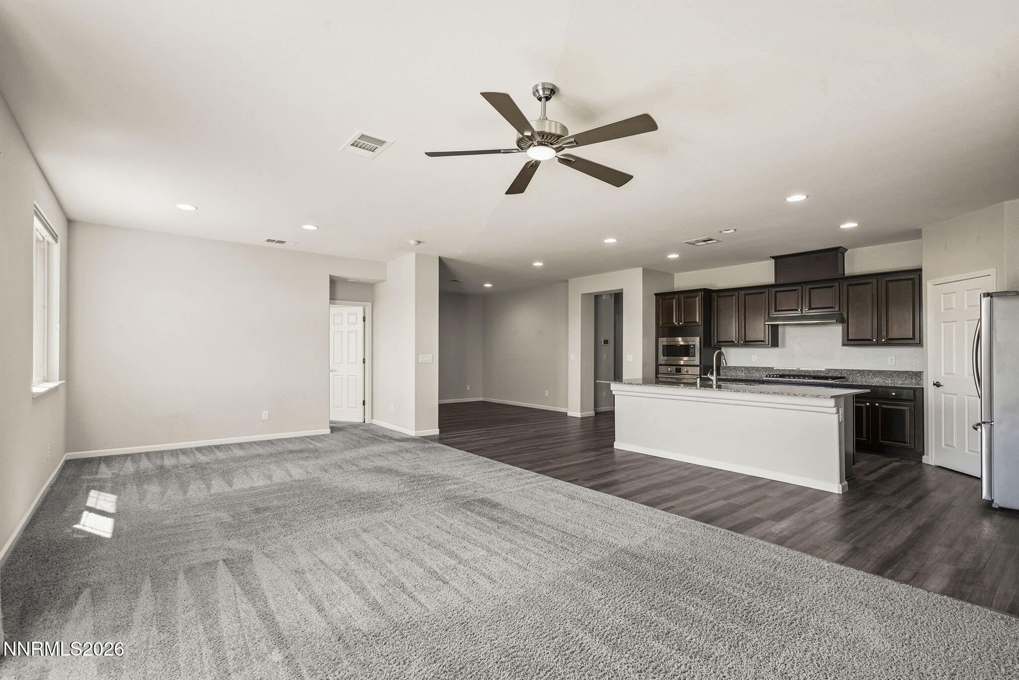 14138 Glowing Amber Court Reno, NV 89511 - Photo 5 of 36 a view of kitchen with wooden floor and electronic appliances