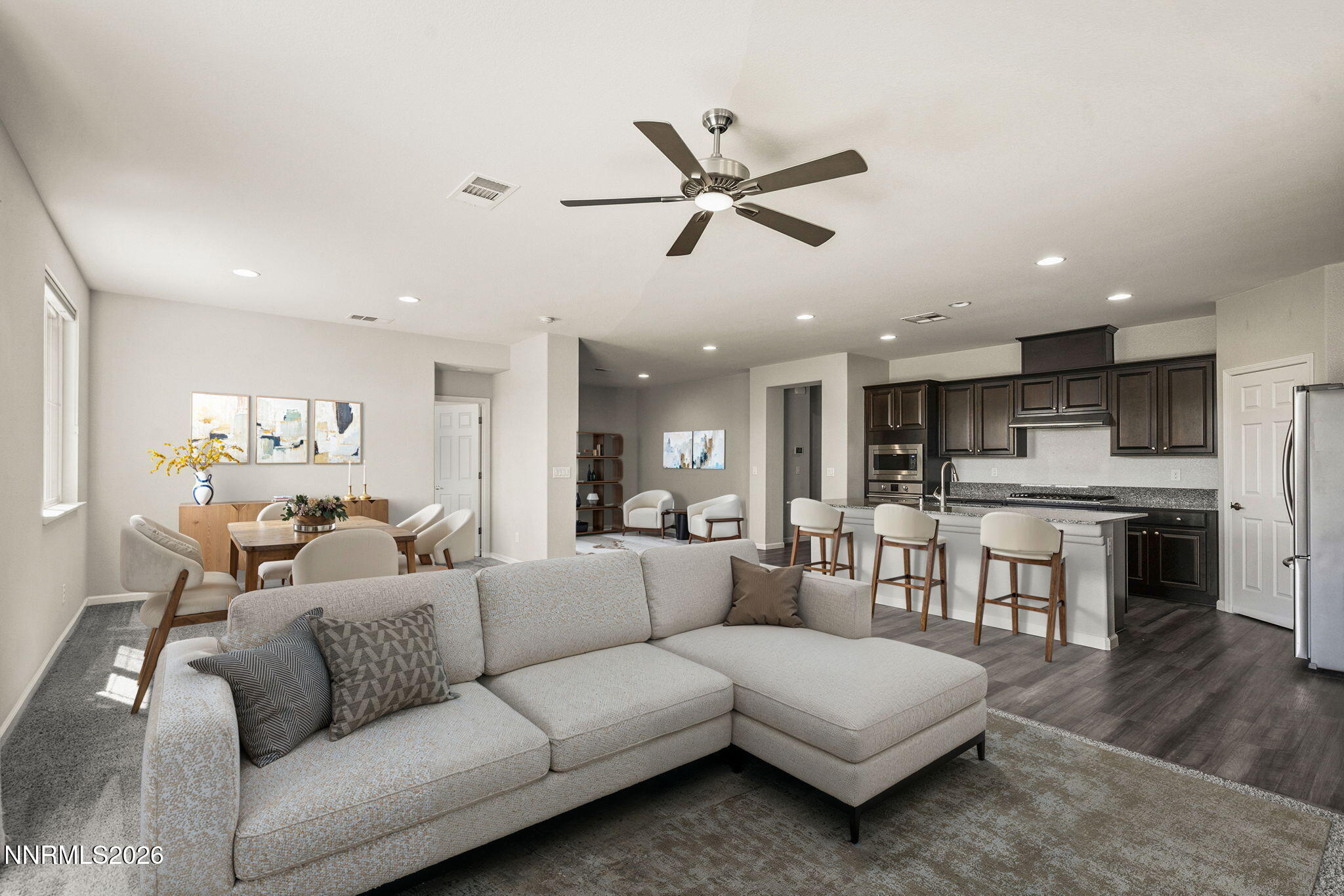 14138 Glowing Amber Court Reno, NV 89511 - Photo 6 of 36 a living room with furniture kitchen and a wooden floor