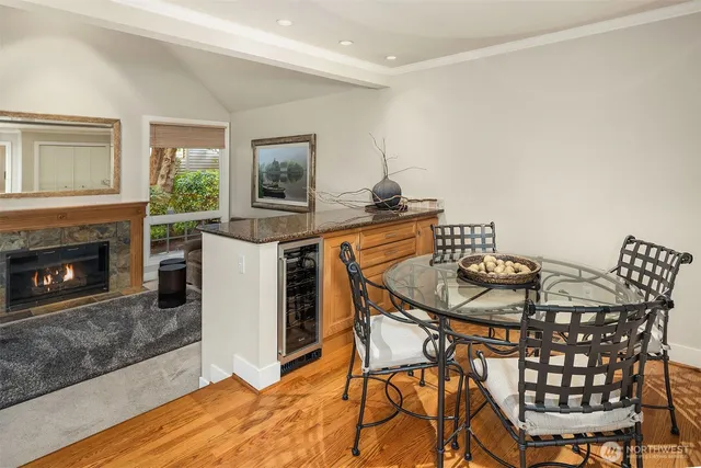 a view of a dining room with furniture and a fireplace