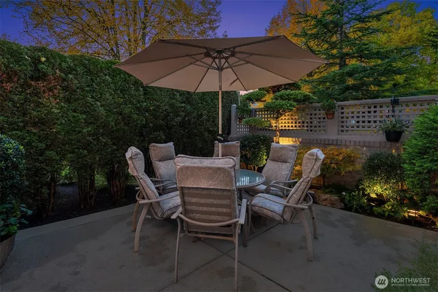a patio with a patio table and chairs