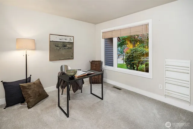 a work room with furniture and a window