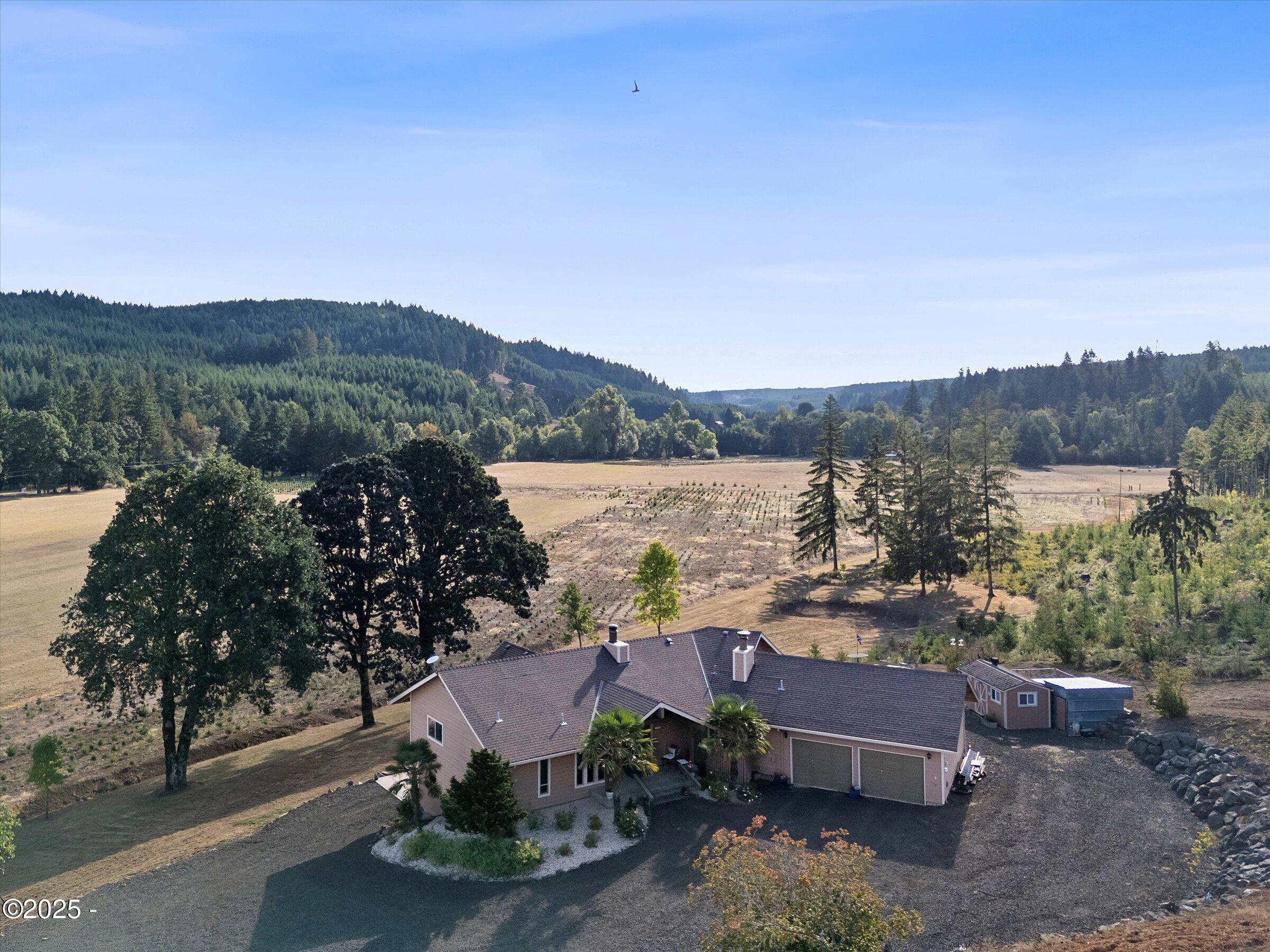 21560 Gooseneck Road Sheridan, OR 97378 - Photo 7 of 63 a view of a garden with mountain