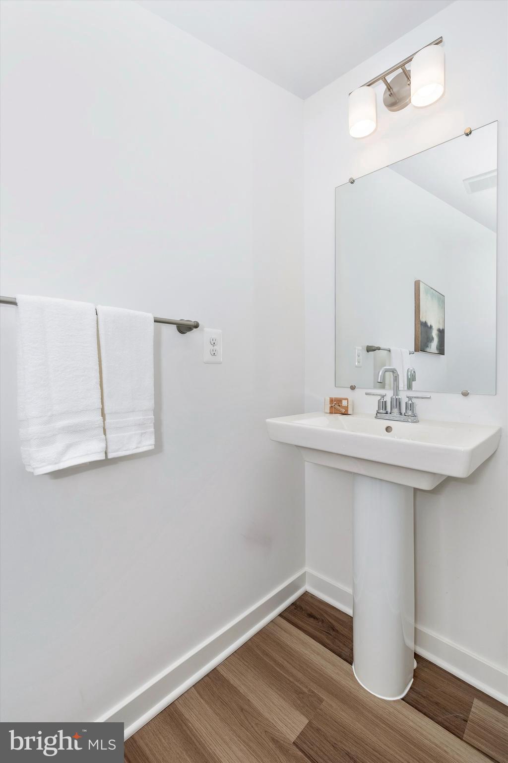 709 B Iron Frg Road Frederick, MD 21702 - Photo 19 of 32 a bathroom with a sink and a mirror