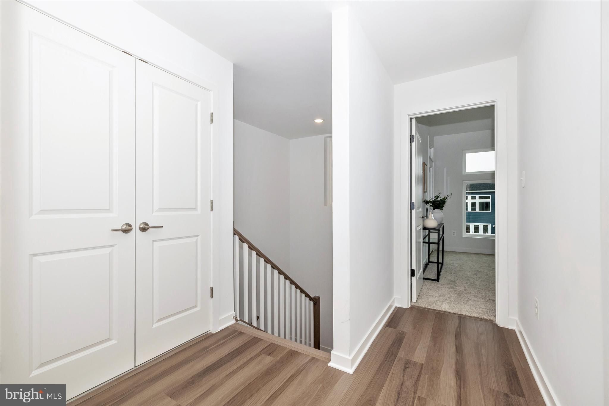 709 B Iron Frg Road Frederick, MD 21702 - Photo 20 of 32 a view of a hallway with wooden floor