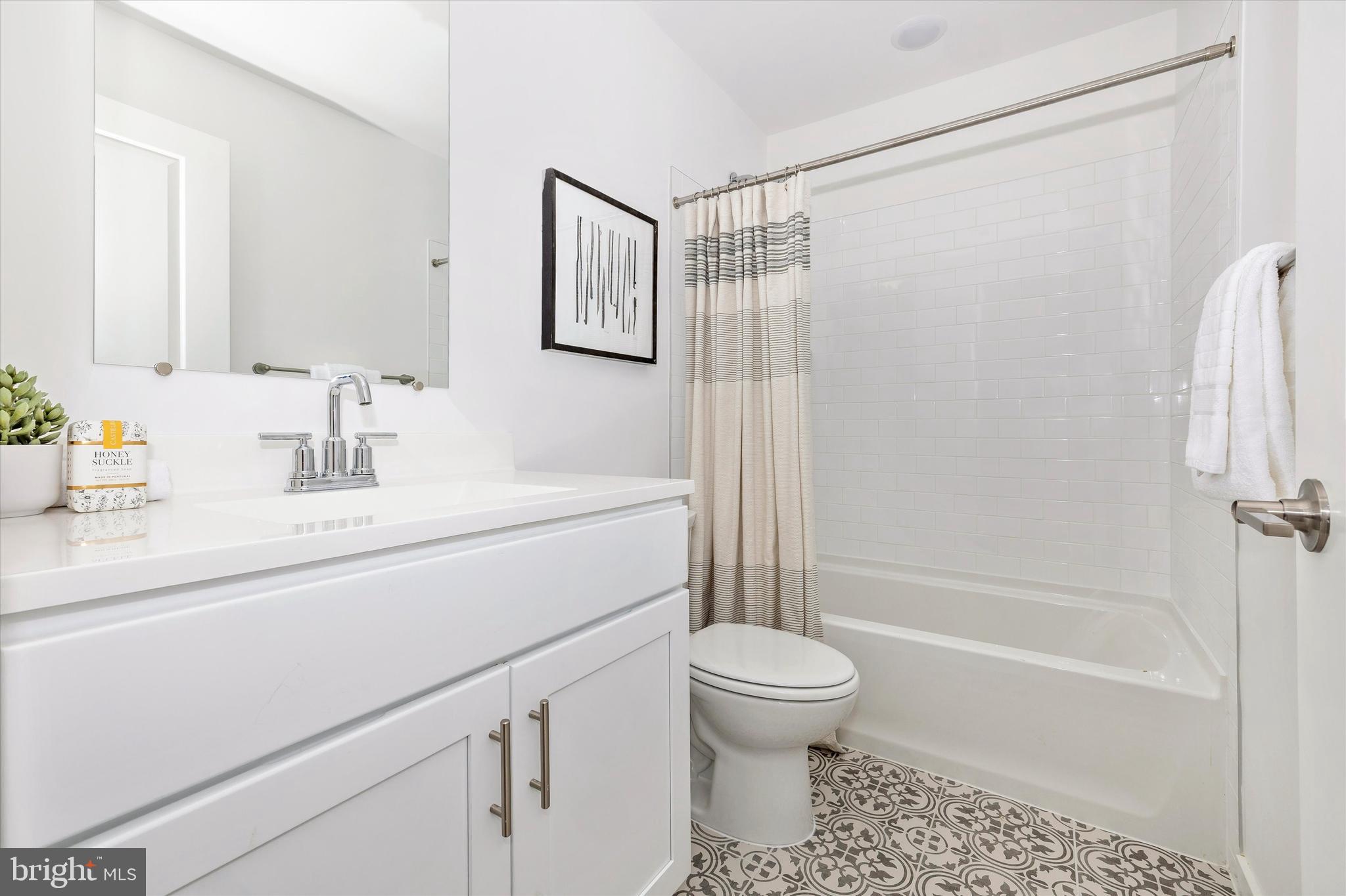 709 B Iron Frg Road Frederick, MD 21702 - Photo 30 of 32 a bathroom with a sink toilet and shower