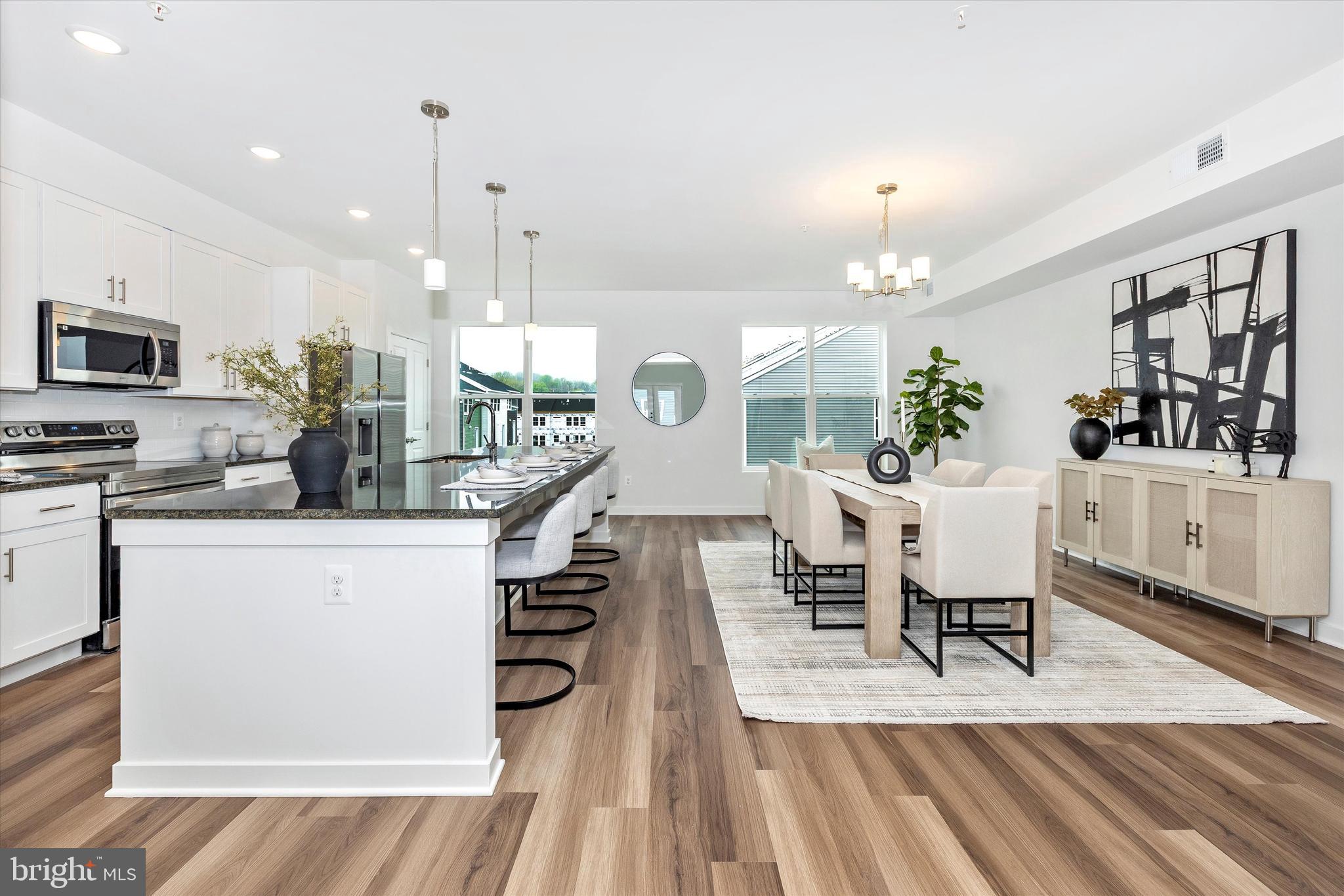 709 B Iron Frg Road Frederick, MD 21702 - Photo 5 of 32 a large kitchen with a table and chairs