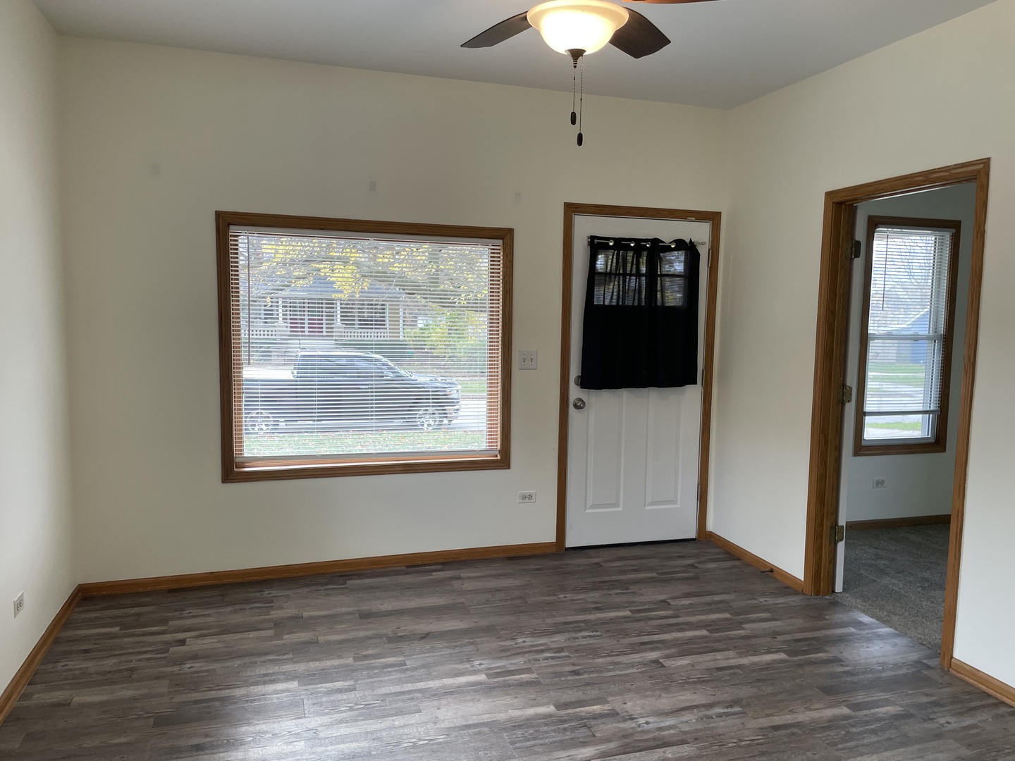 320 East 13th Street, Unit A Lockport, IL 60441 - Photo 12 of 24 an empty room with wooden floor cabinet and windows
