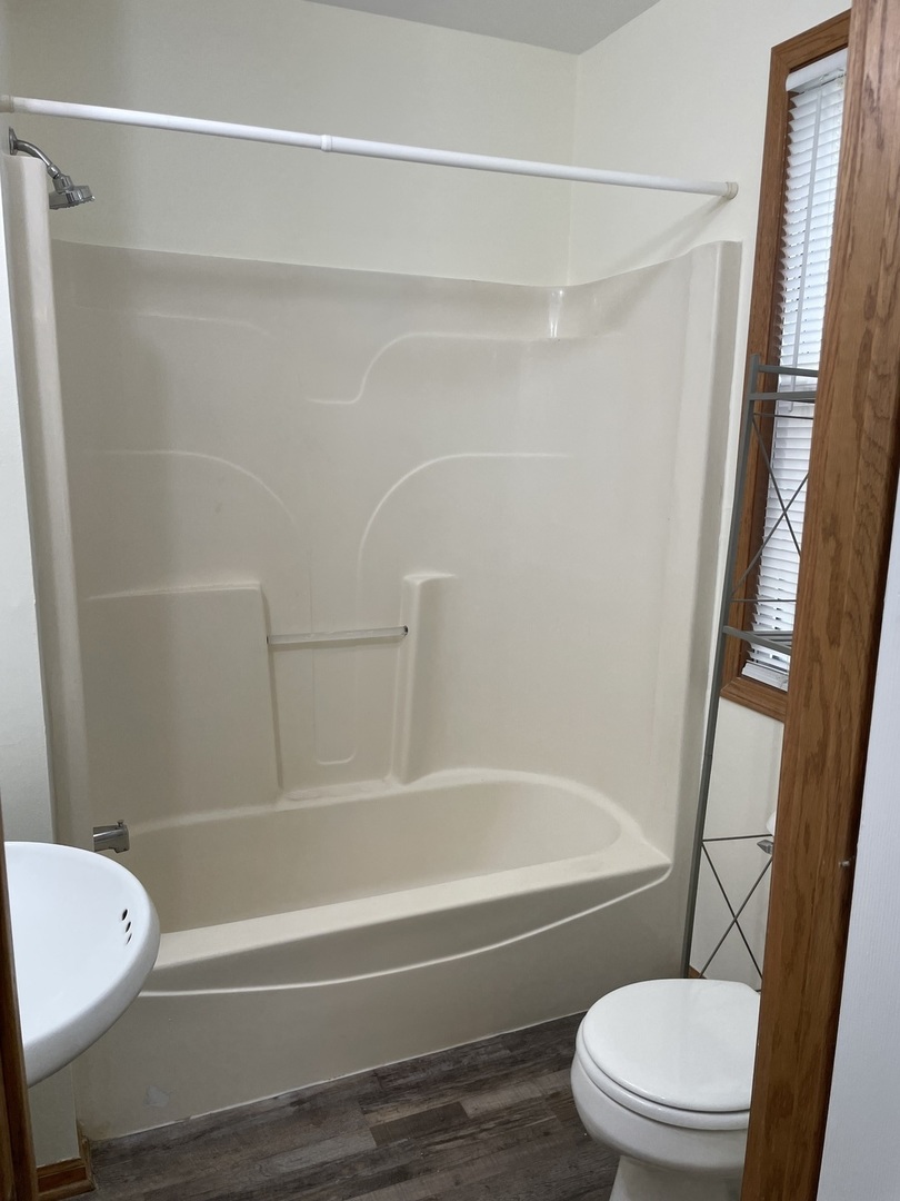 320 East 13th Street, Unit A Lockport, IL 60441 - Photo 23 of 24 a bathroom with a toilet and a bathtub