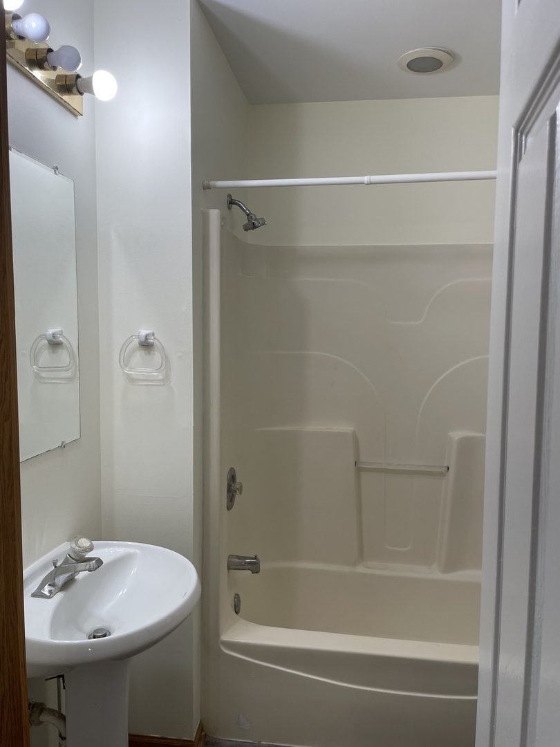 320 East 13th Street, Unit A Lockport, IL 60441 - Photo 24 of 24 a bathroom with a sink and a mirror