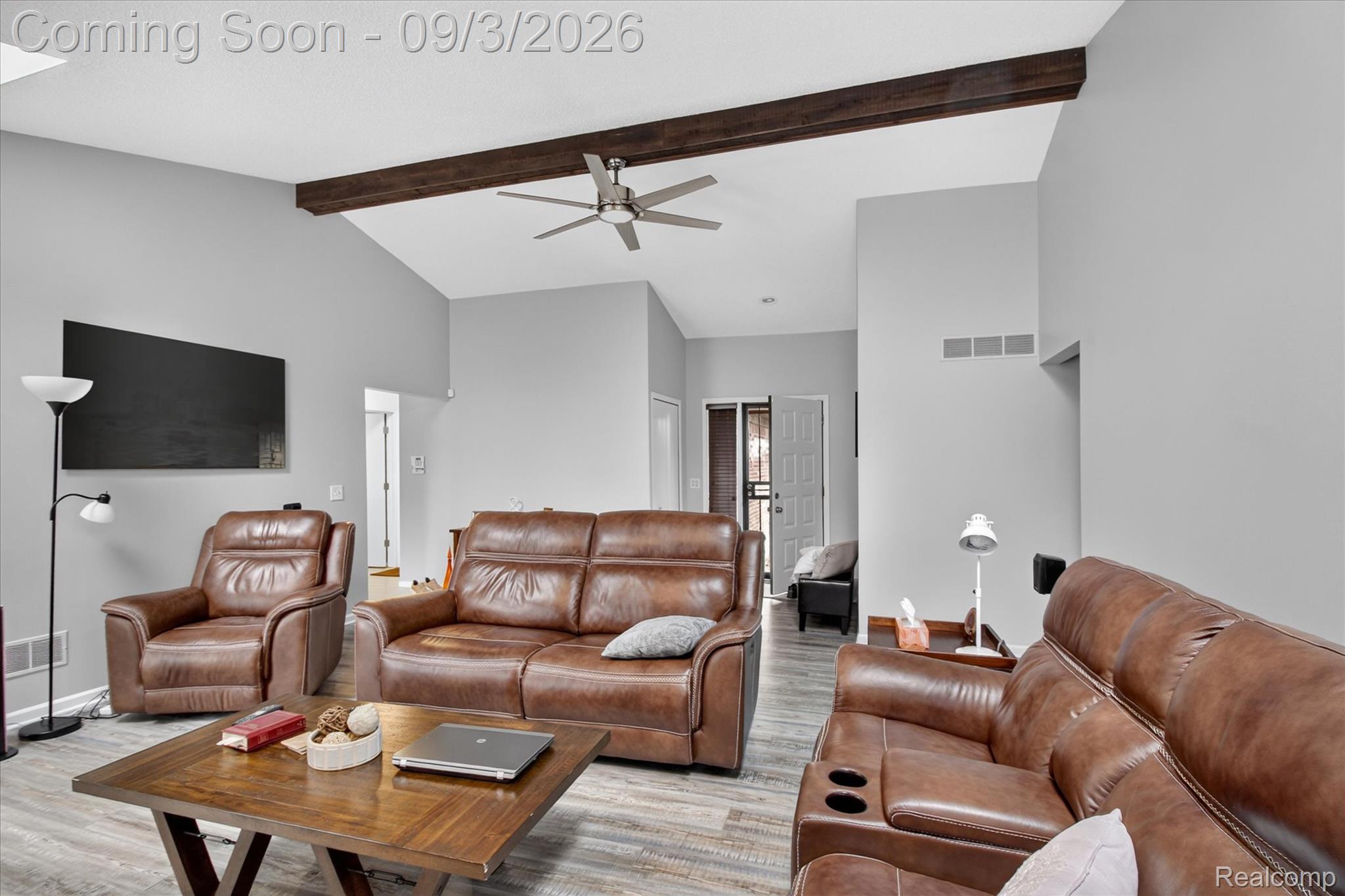 27260 Campbell Road Warren, MI 48093 - Photo 9 of 60 Vaulted ceiling with wood-finish beam, ceiling fan, and wood-finish flooring