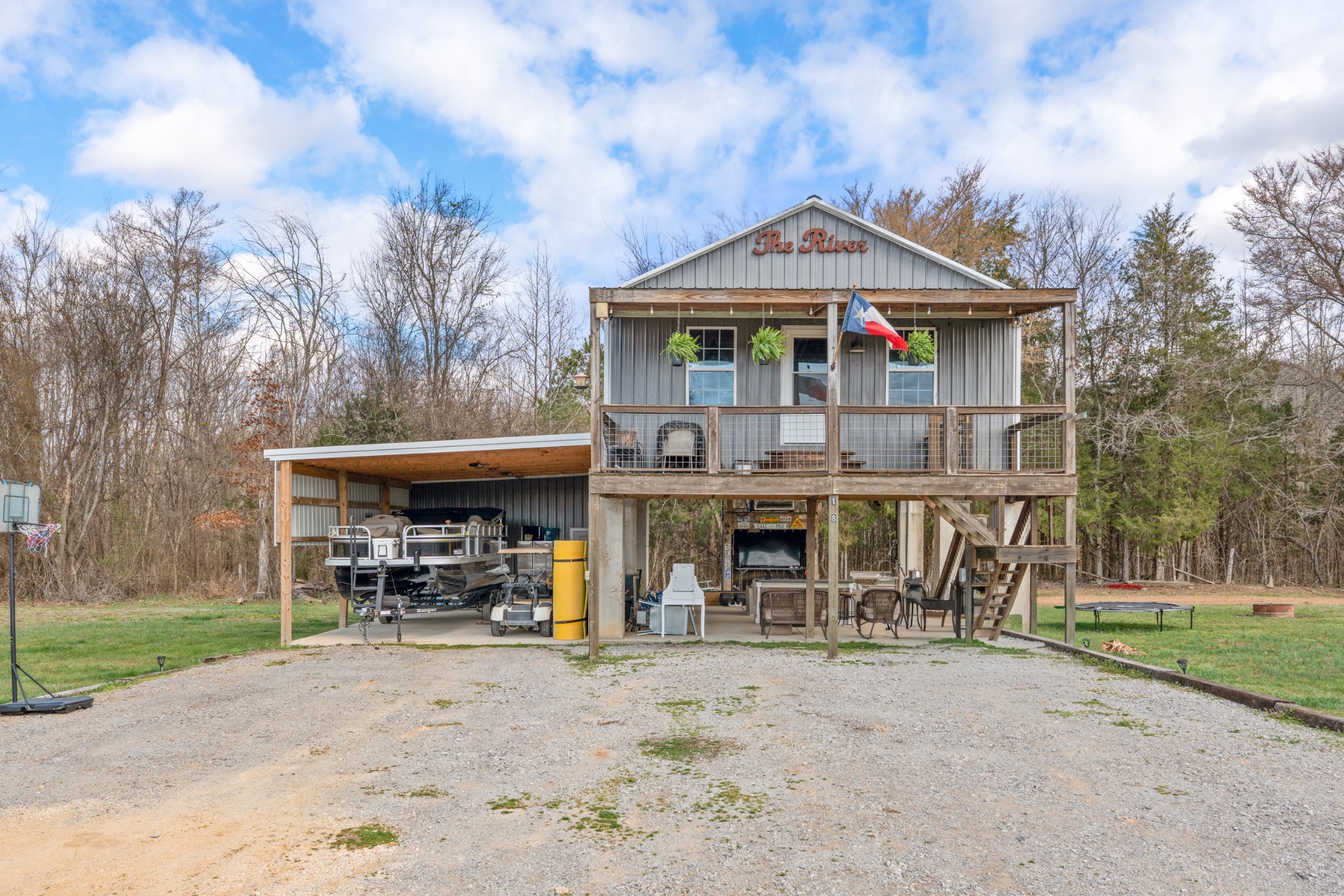 168 Mackin Road Linden, TN 37096 - Photo 1 of 32 a front view of a house with garden