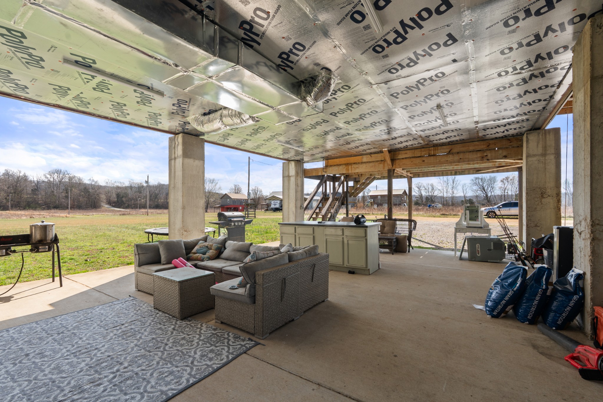 168 Mackin Road Linden, TN 37096 - Photo 12 of 32 a view of a patio with a table and chairs