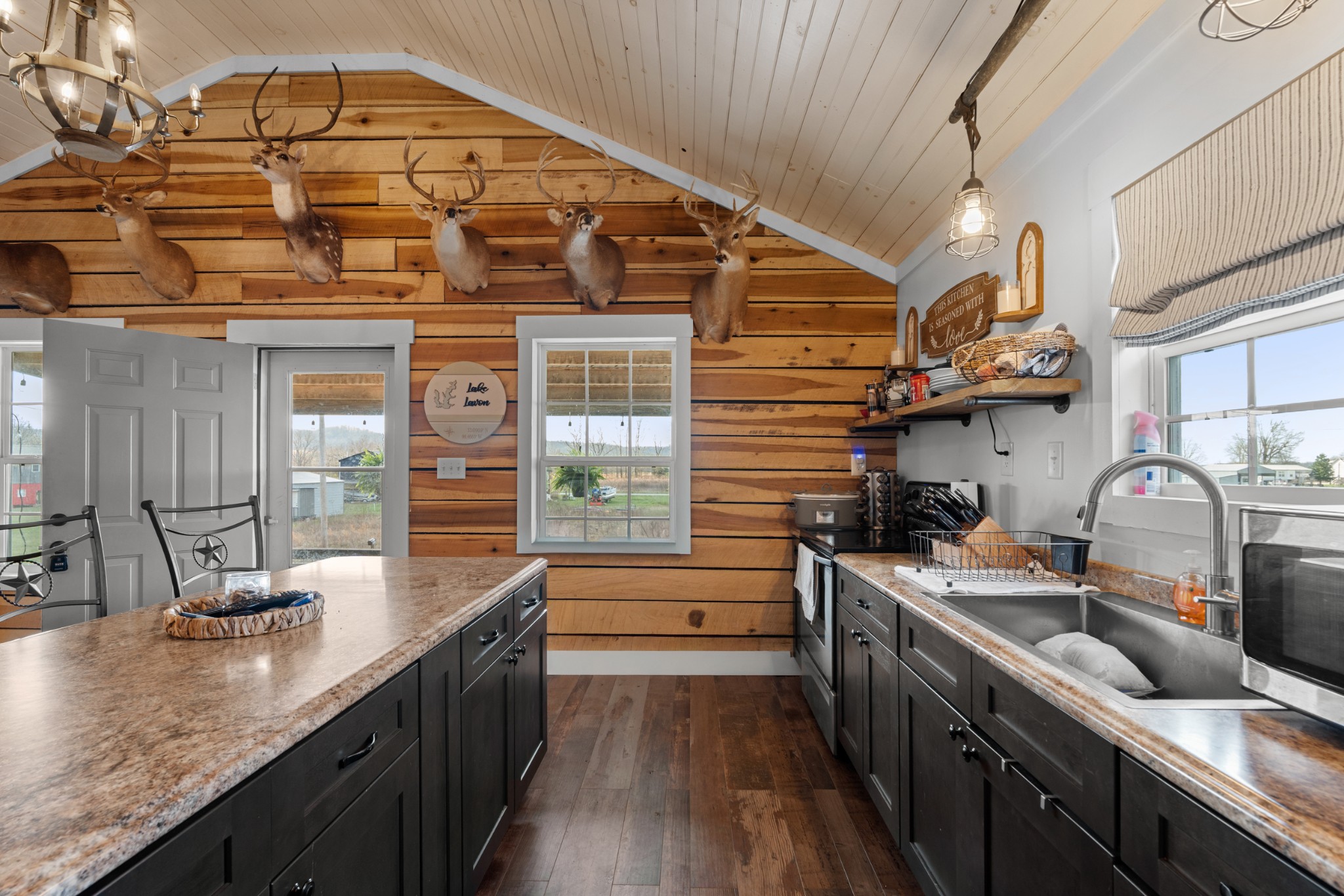 168 Mackin Road Linden, TN 37096 - Photo 20 of 32 a kitchen with stainless steel appliances a sink stove and cabinets