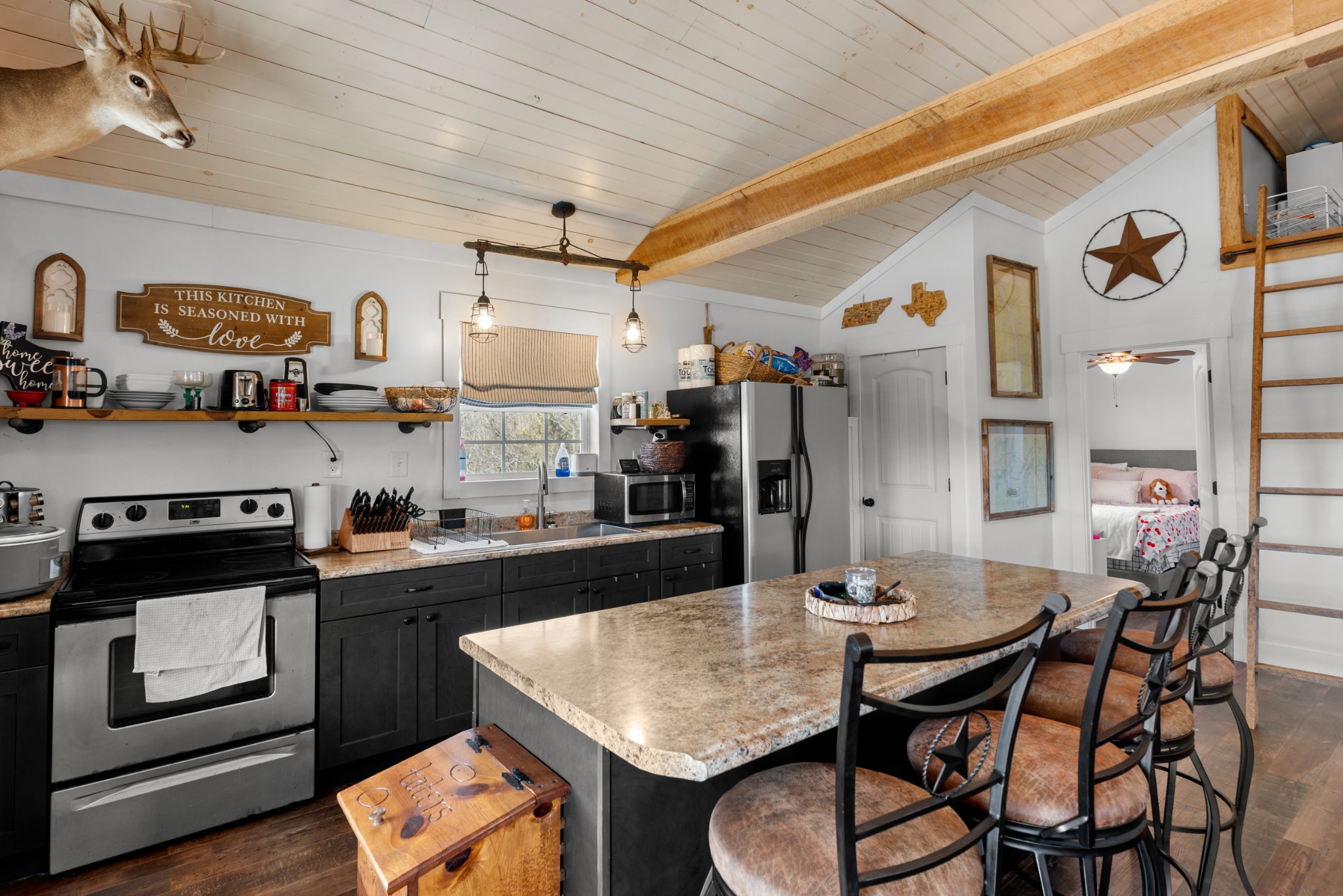 168 Mackin Road Linden, TN 37096 - Photo 22 of 32 a kitchen with stainless steel appliances granite countertop a stove a sink dishwasher and cabinets with wooden floor
