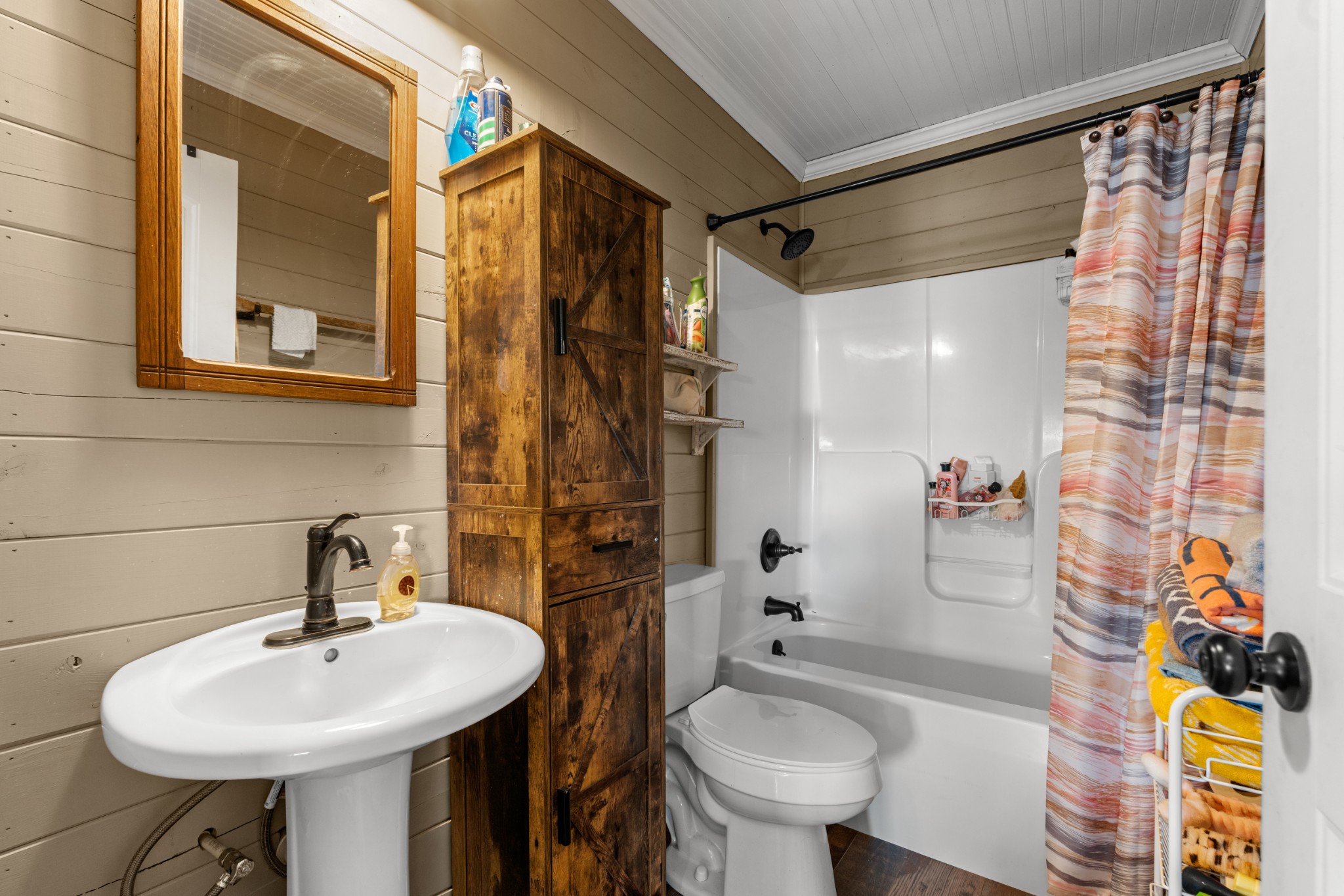 168 Mackin Road Linden, TN 37096 - Photo 25 of 32 a bathroom with a sink toilet and shower