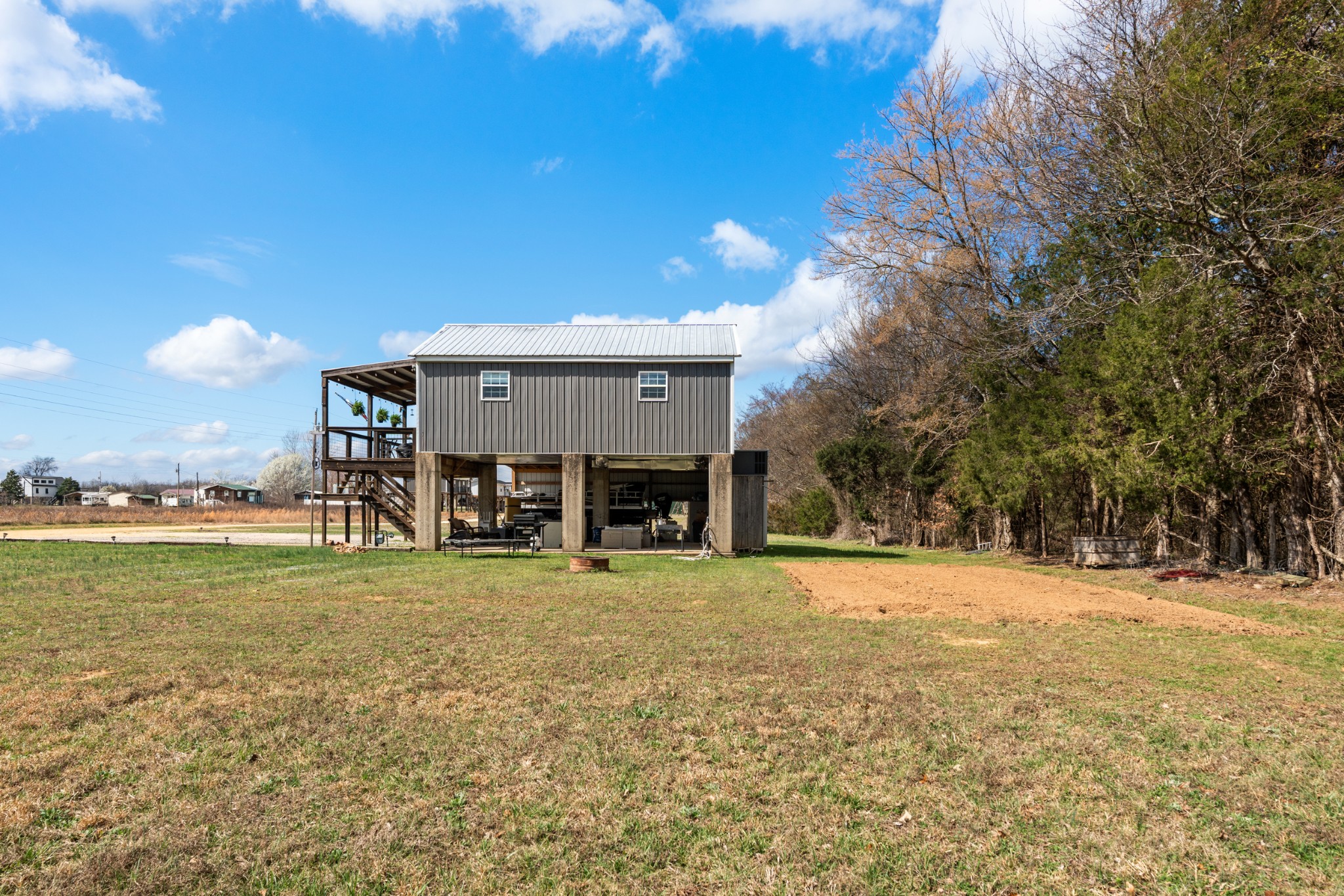 168 Mackin Road Linden, TN 37096 - Photo 30 of 32 a view of a house with a yard and a garage