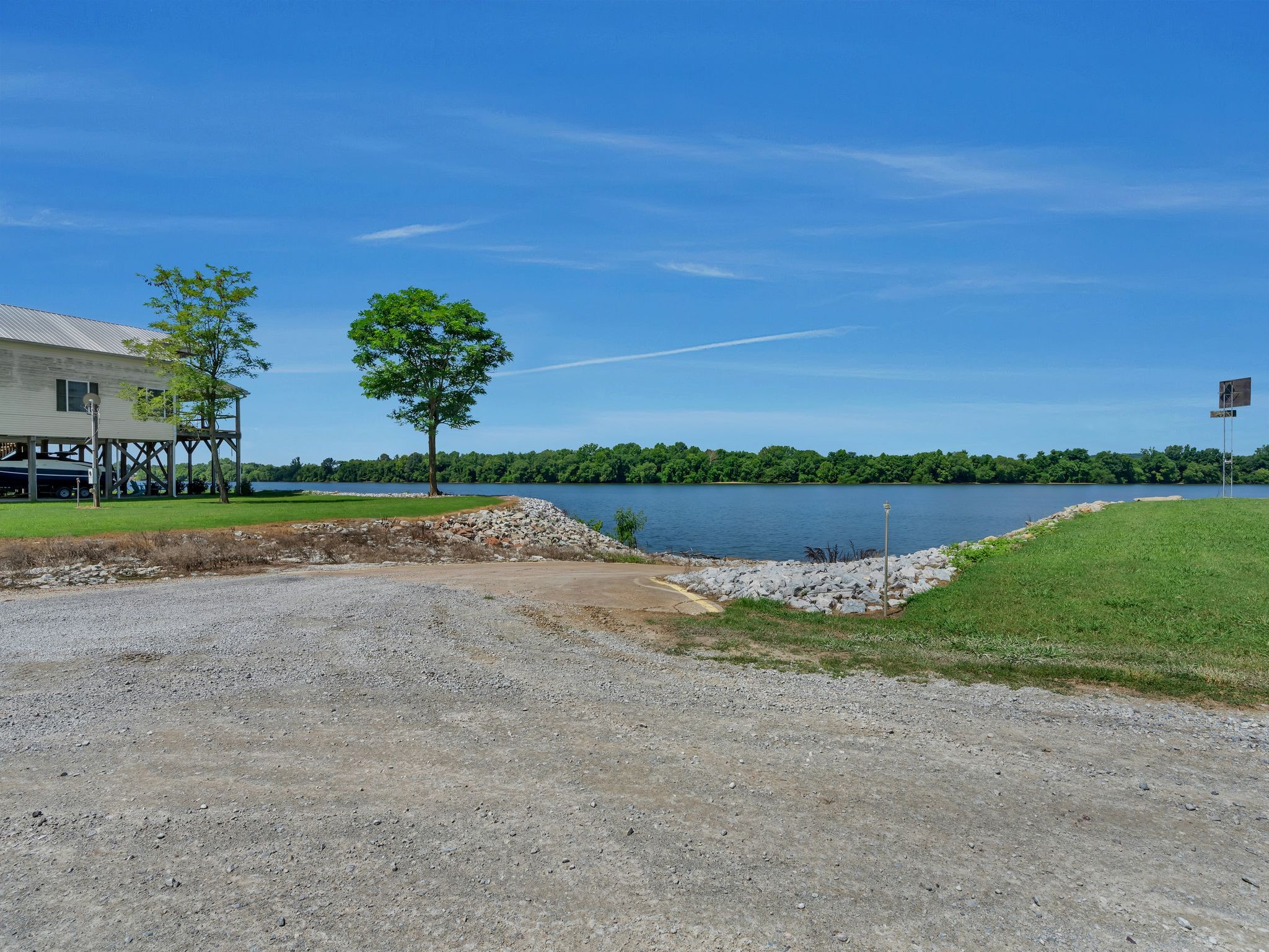 168 Mackin Road Linden, TN 37096 - Photo 31 of 32 a view of a lake with houses in the background
