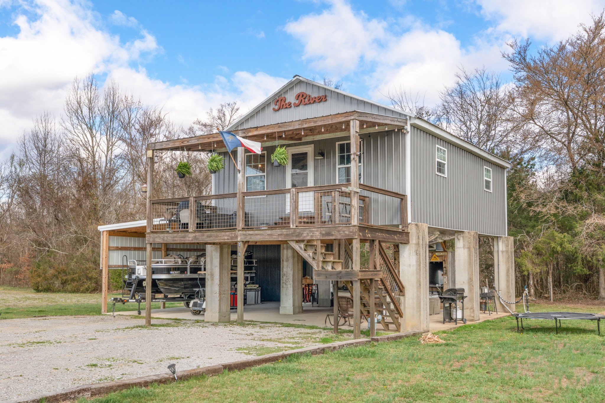 168 Mackin Road Linden, TN 37096 - Photo 4 of 32 a front view of a house with garden