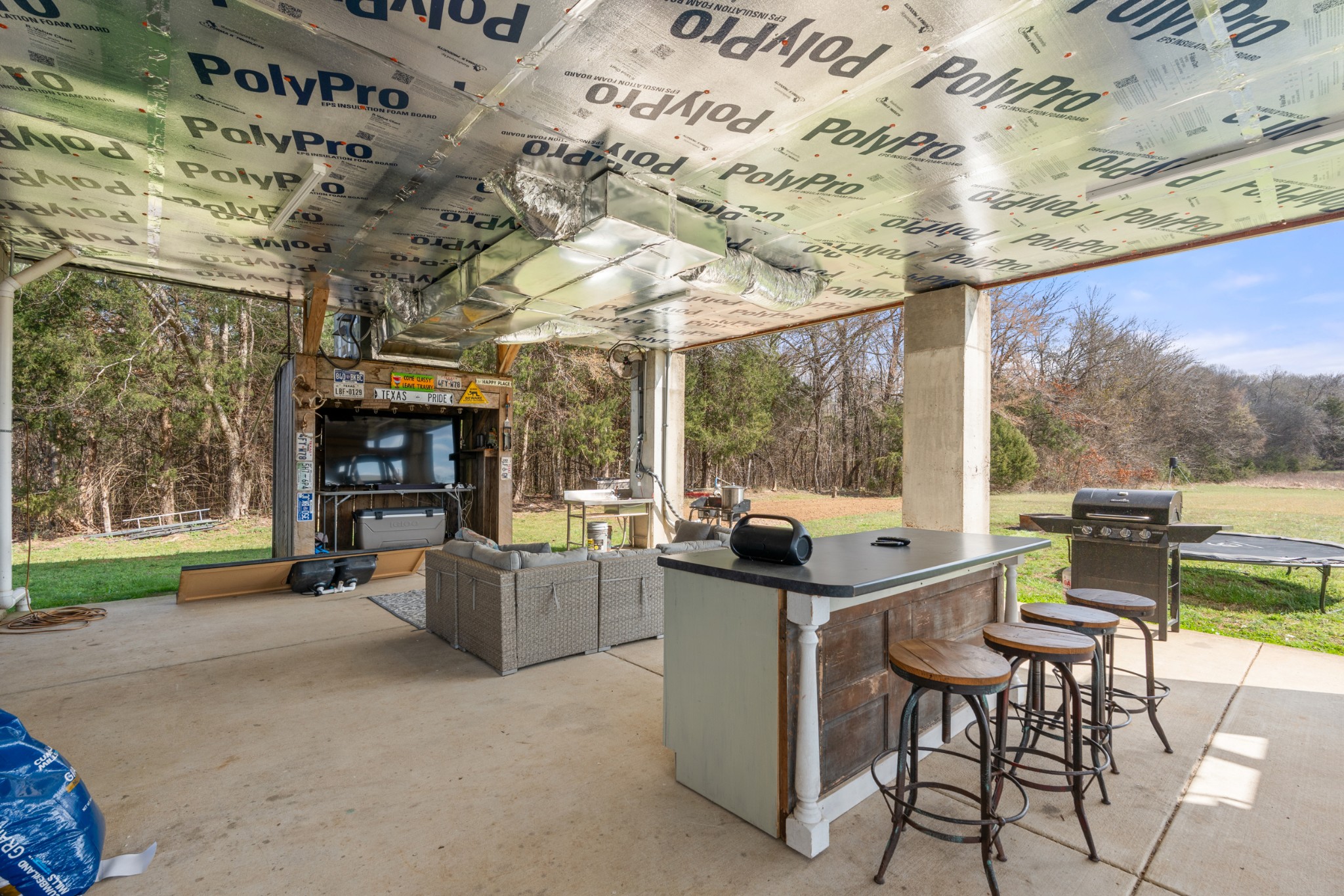 168 Mackin Road Linden, TN 37096 - Photo 9 of 32 a view of a patio with a dining table and chairs