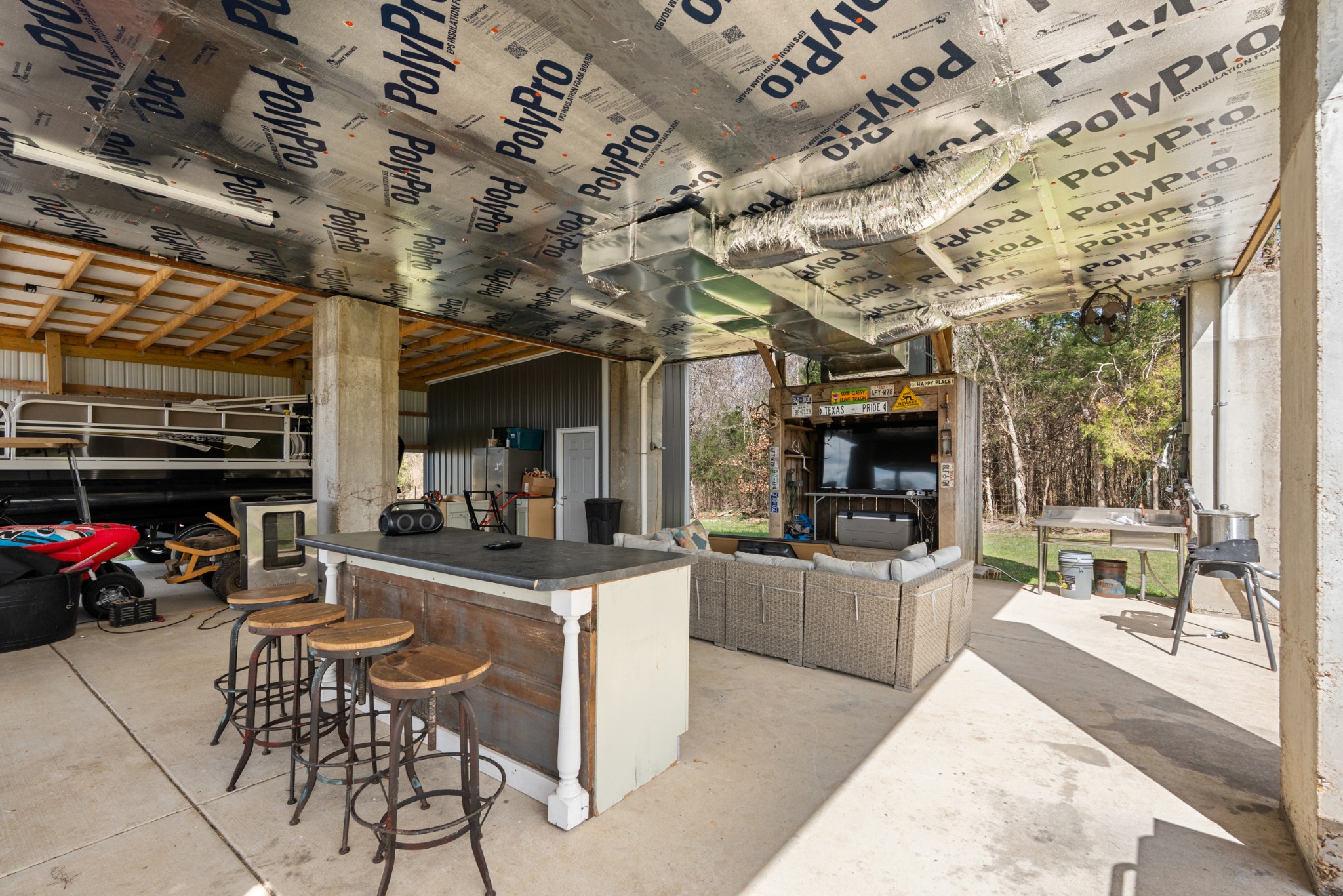 168 Mackin Road Linden, TN 37096 - Photo 10 of 32 a view of a kitchen with furniture and a grill