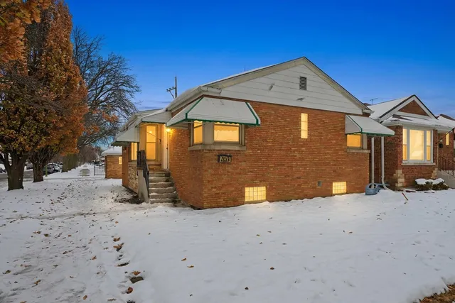 a view of a house with a snow in the yard