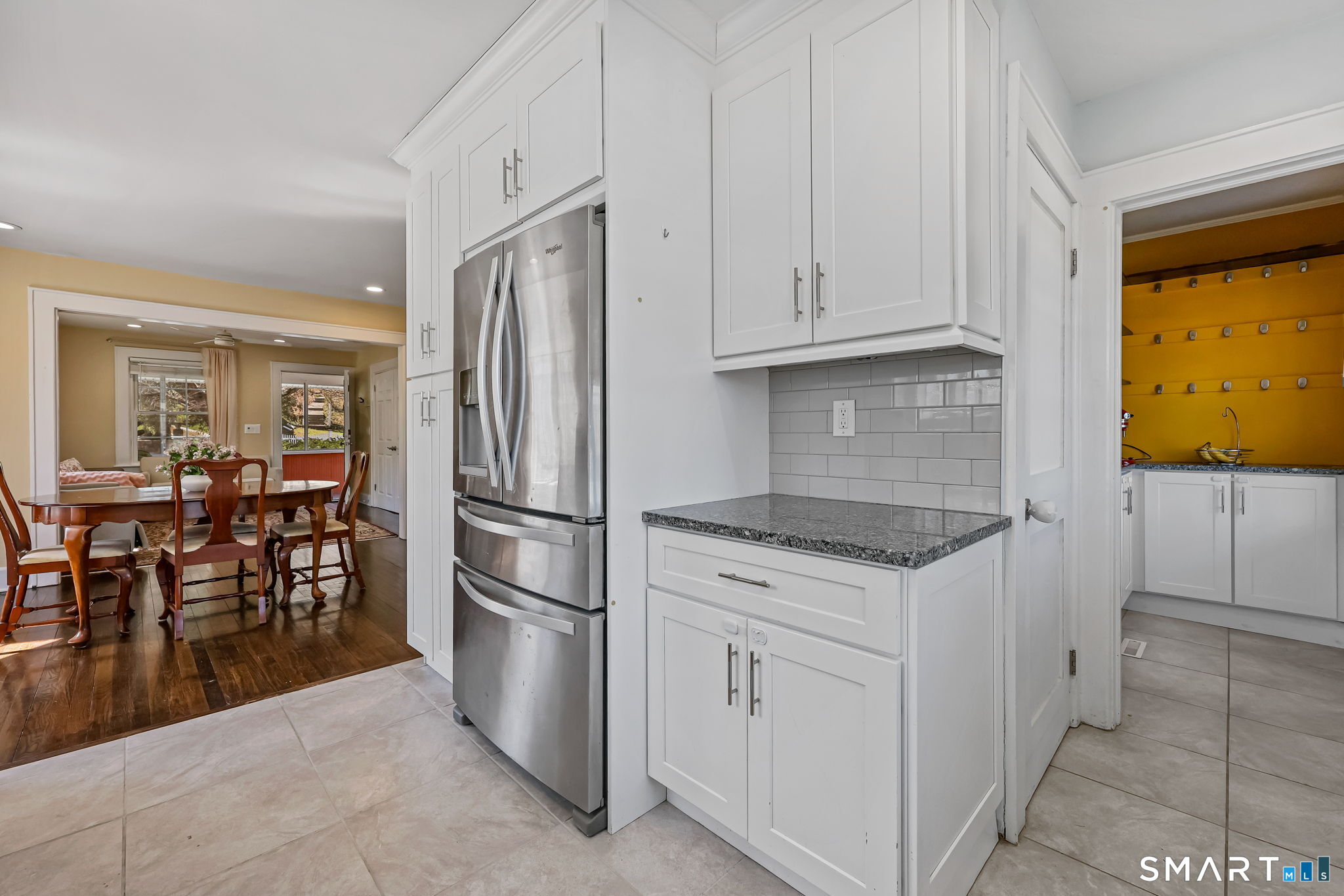 105 Knickerbocker Avenue Stamford, CT 06907 - Photo 13 of 31 a kitchen with white cabinets and stainless steel appliances