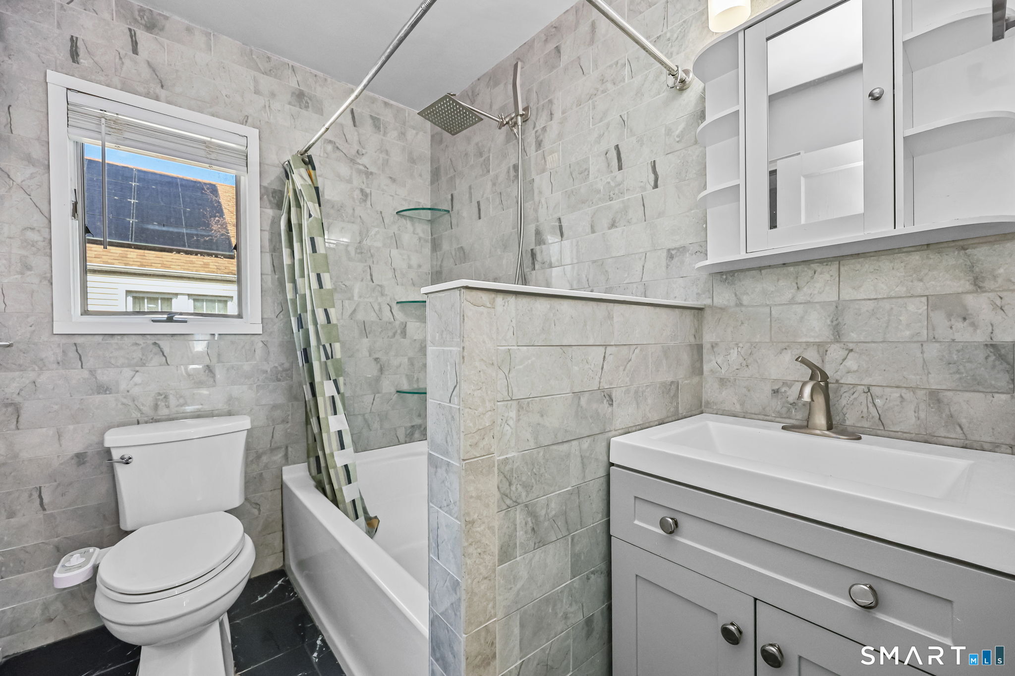 105 Knickerbocker Avenue Stamford, CT 06907 - Photo 16 of 31 a bathroom with a sink a toilet and shower