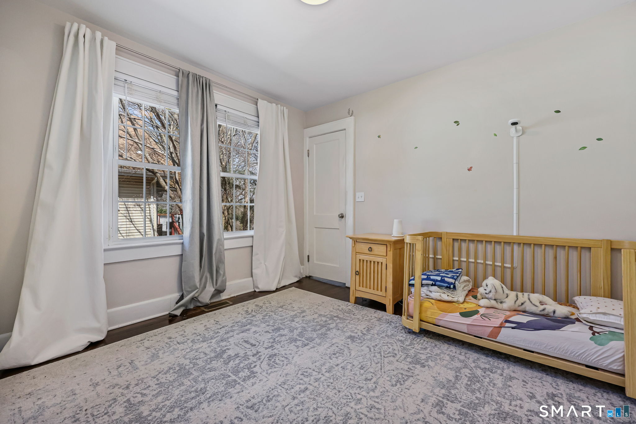 105 Knickerbocker Avenue Stamford, CT 06907 - Photo 18 of 31 a bedroom with furniture and a window