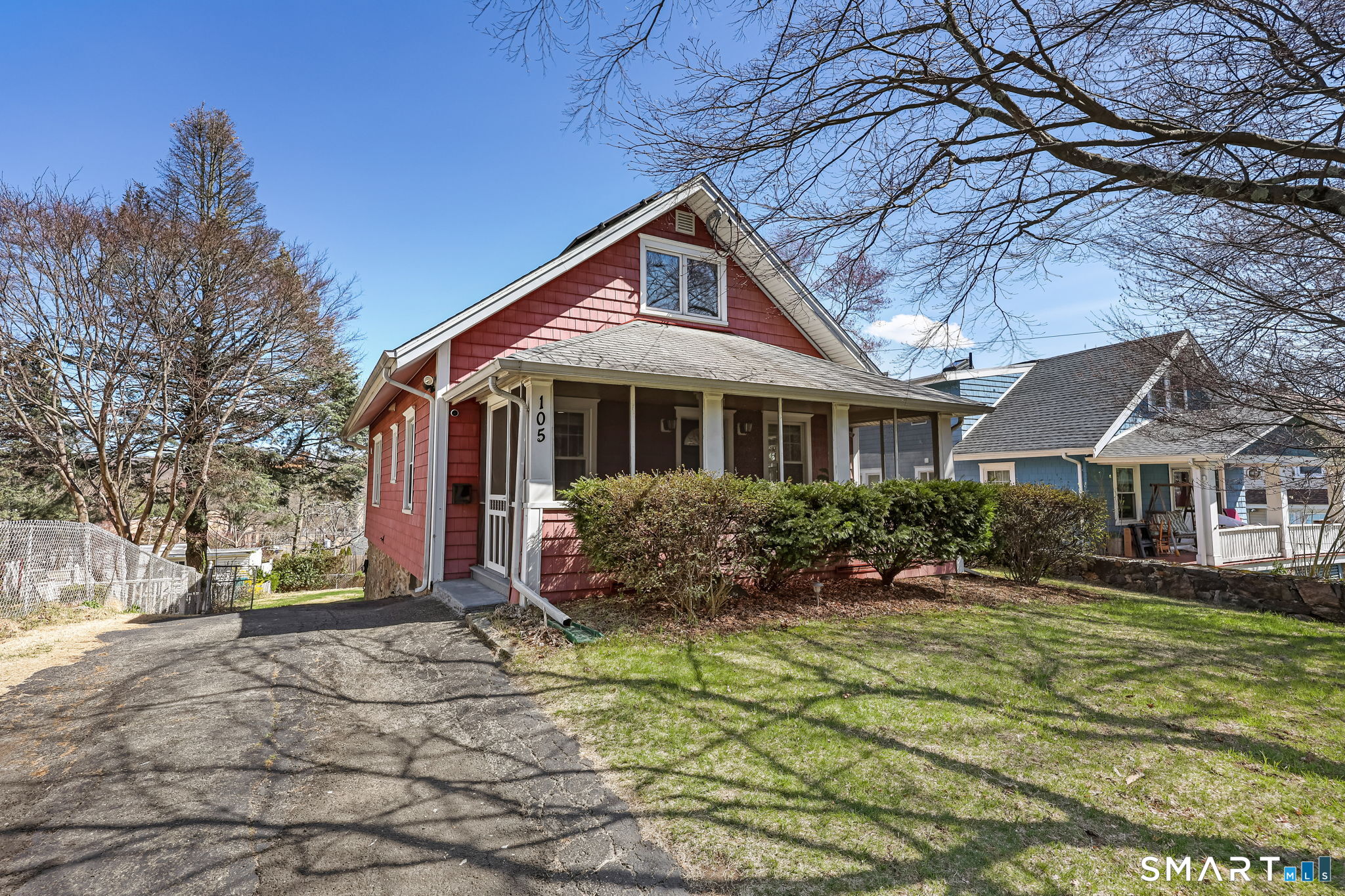 105 Knickerbocker Avenue Stamford, CT 06907 - Photo 2 of 31 a front view of house with yard and trees around