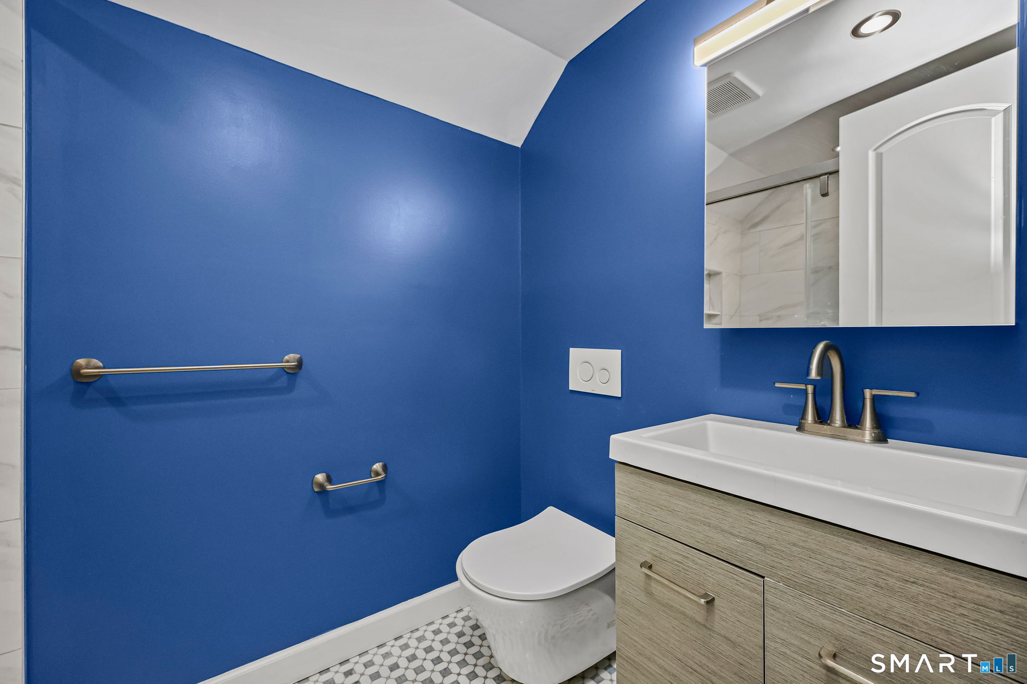 105 Knickerbocker Avenue Stamford, CT 06907 - Photo 22 of 31 a bathroom with a toilet a sink and mirror