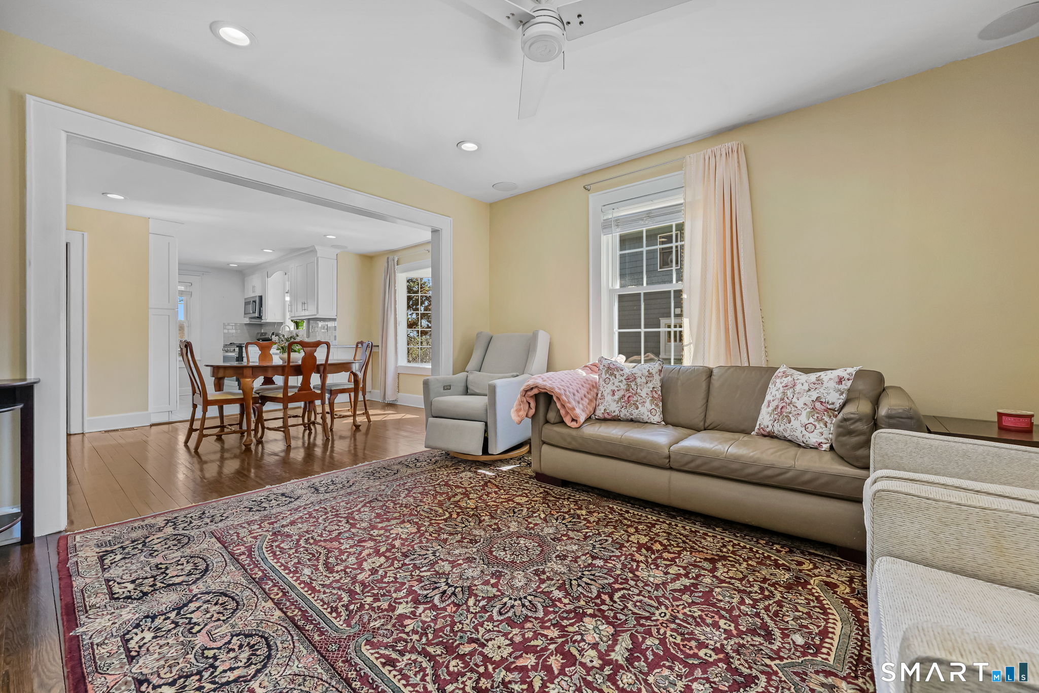 105 Knickerbocker Avenue Stamford, CT 06907 - Photo 6 of 31 a living room with furniture and a dining table