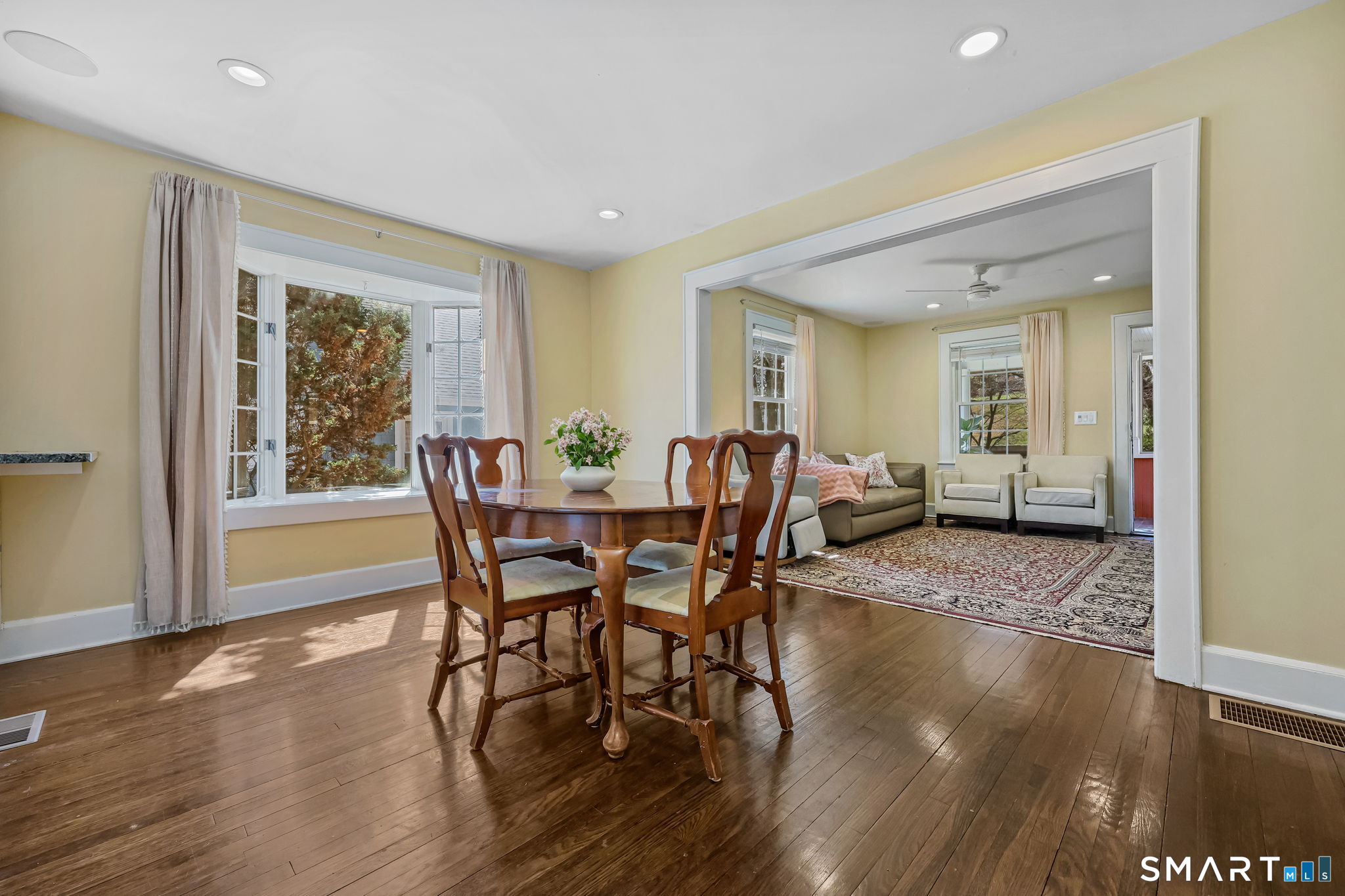 105 Knickerbocker Avenue Stamford, CT 06907 - Photo 8 of 31 a view of a dining room with furniture and wooden floor