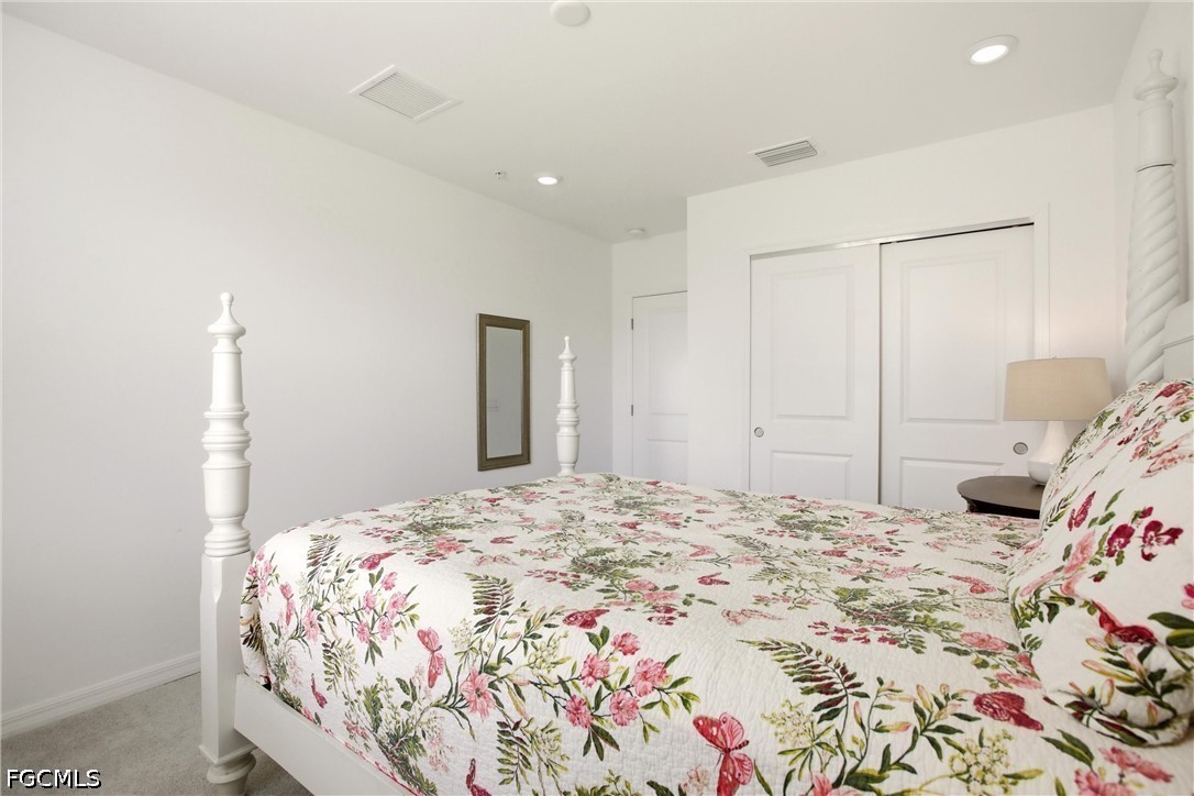 3751 Pebblebrook Ridge Court, Unit 101 Fort Myers, FL 33905 - Photo 24 of 48 a bedroom with a bed and a window