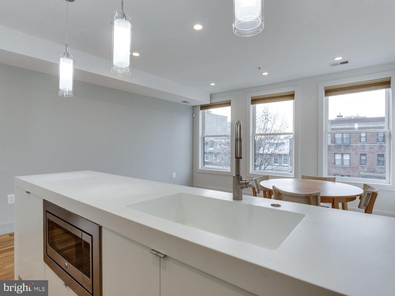 254 15th Street Southeast, Unit 4 Washington, DC 20003 - Photo 7 of 23 a view of a kitchen with a sink and large window