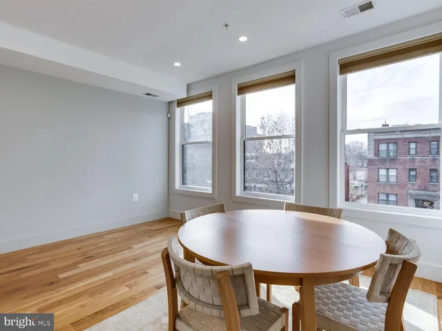 a view of a dining room with furniture and window