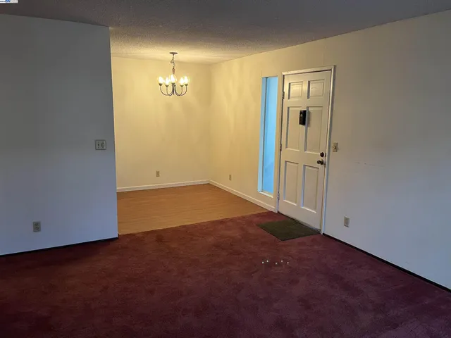 an empty room with closet area