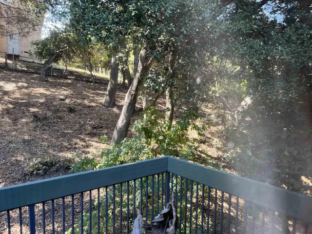 a view of a balcony with an outdoor space