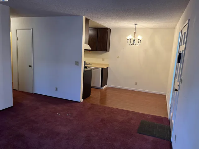 an empty room with a flat screen tv