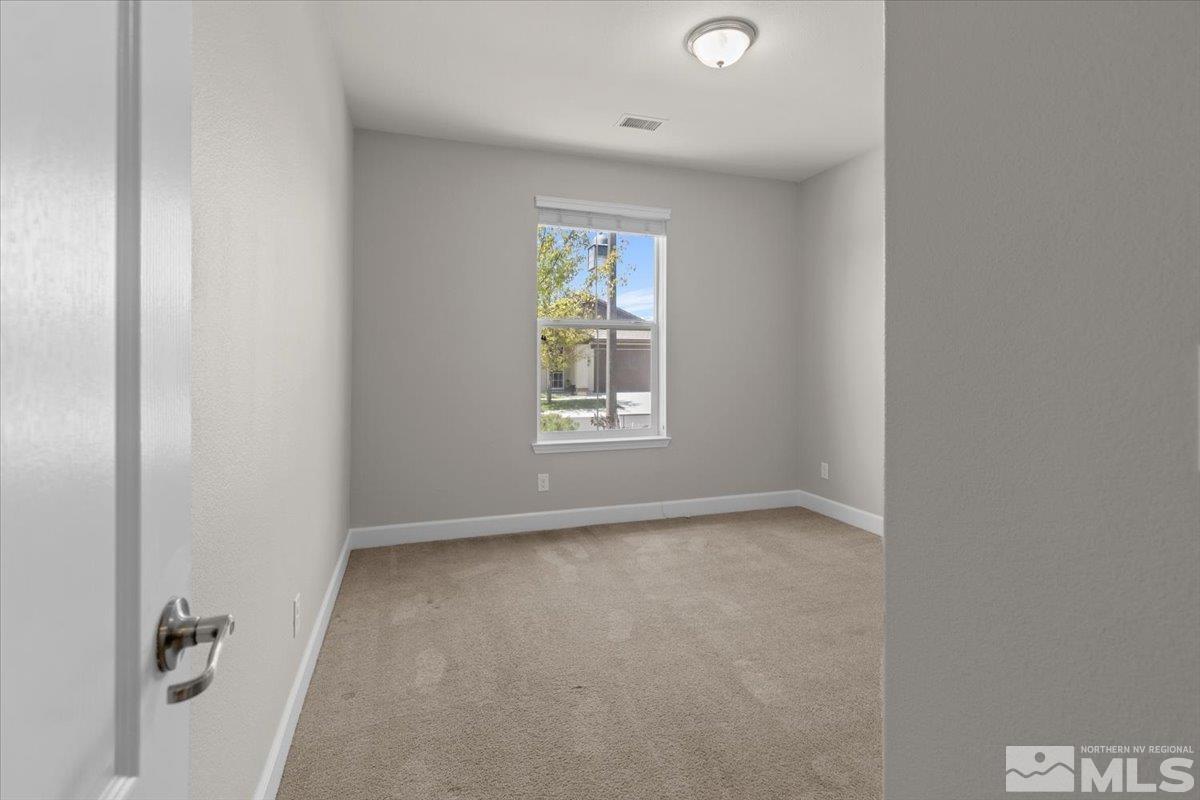 10098 Ignacio Circle Reno, NV 89521 - Photo 21 of 40 a view of an empty room with a window