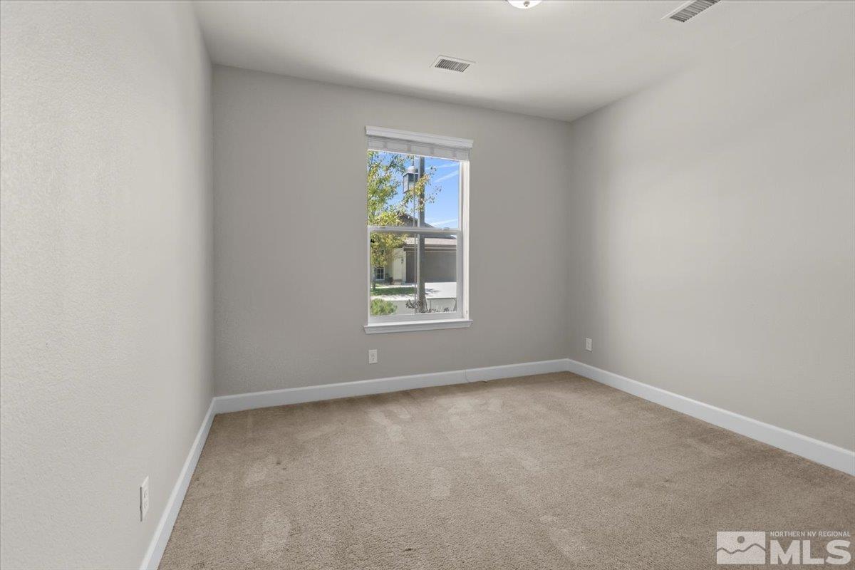 10098 Ignacio Circle Reno, NV 89521 - Photo 22 of 40 an empty room with windows